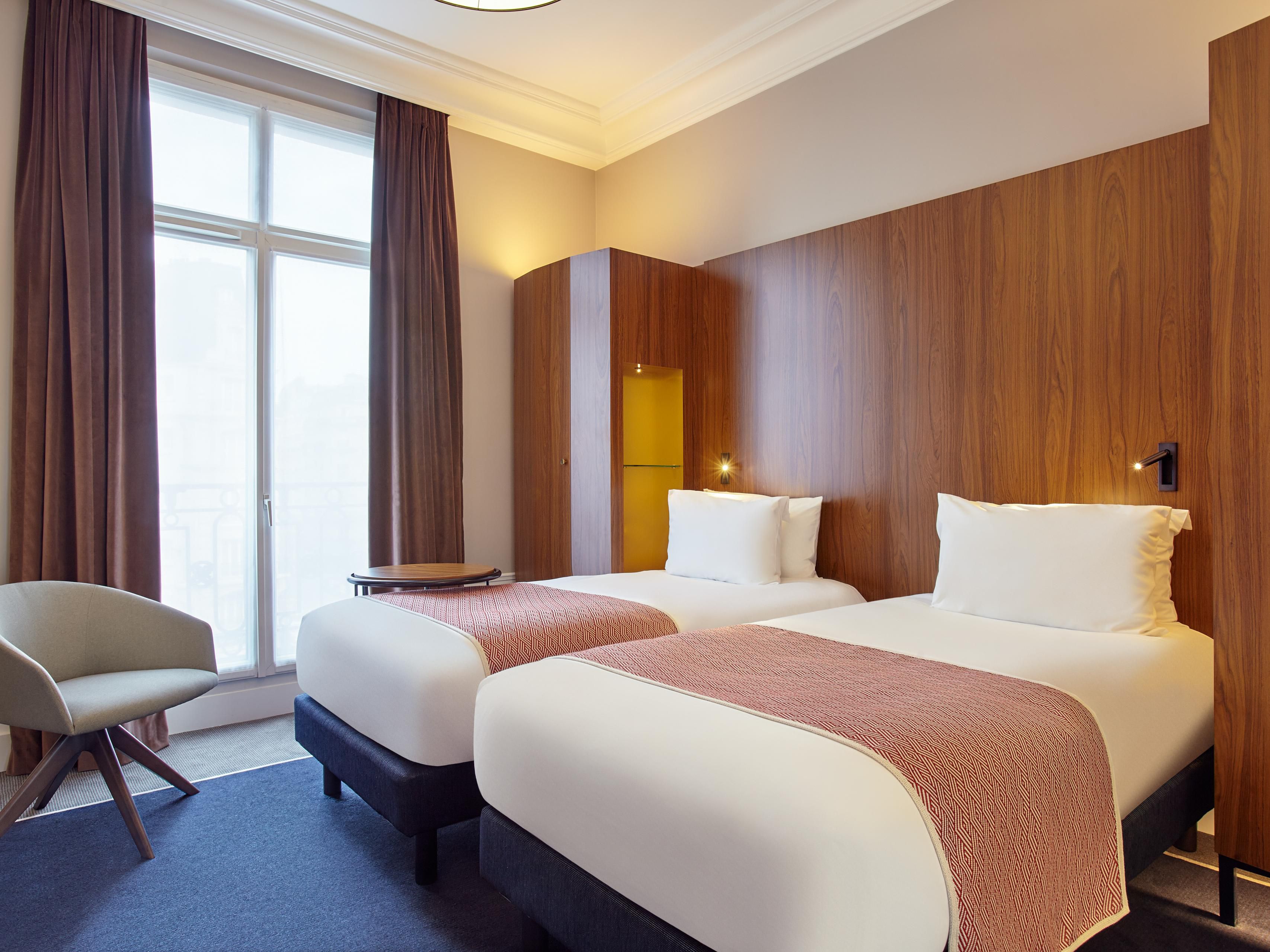 Enjoy the comforts of our newly-renovated rooms and suites with views of the Paris cityscape. Our Paris accommodations feature a mini-fridge, 42-inch flat-screen TVs, Wi-Fi and Nespresso coffee. Work and unwind in our executive rooms with desks, bathrobes, and slippers. Feel at home in our welcoming suites with separate living areas and a sofa bed.