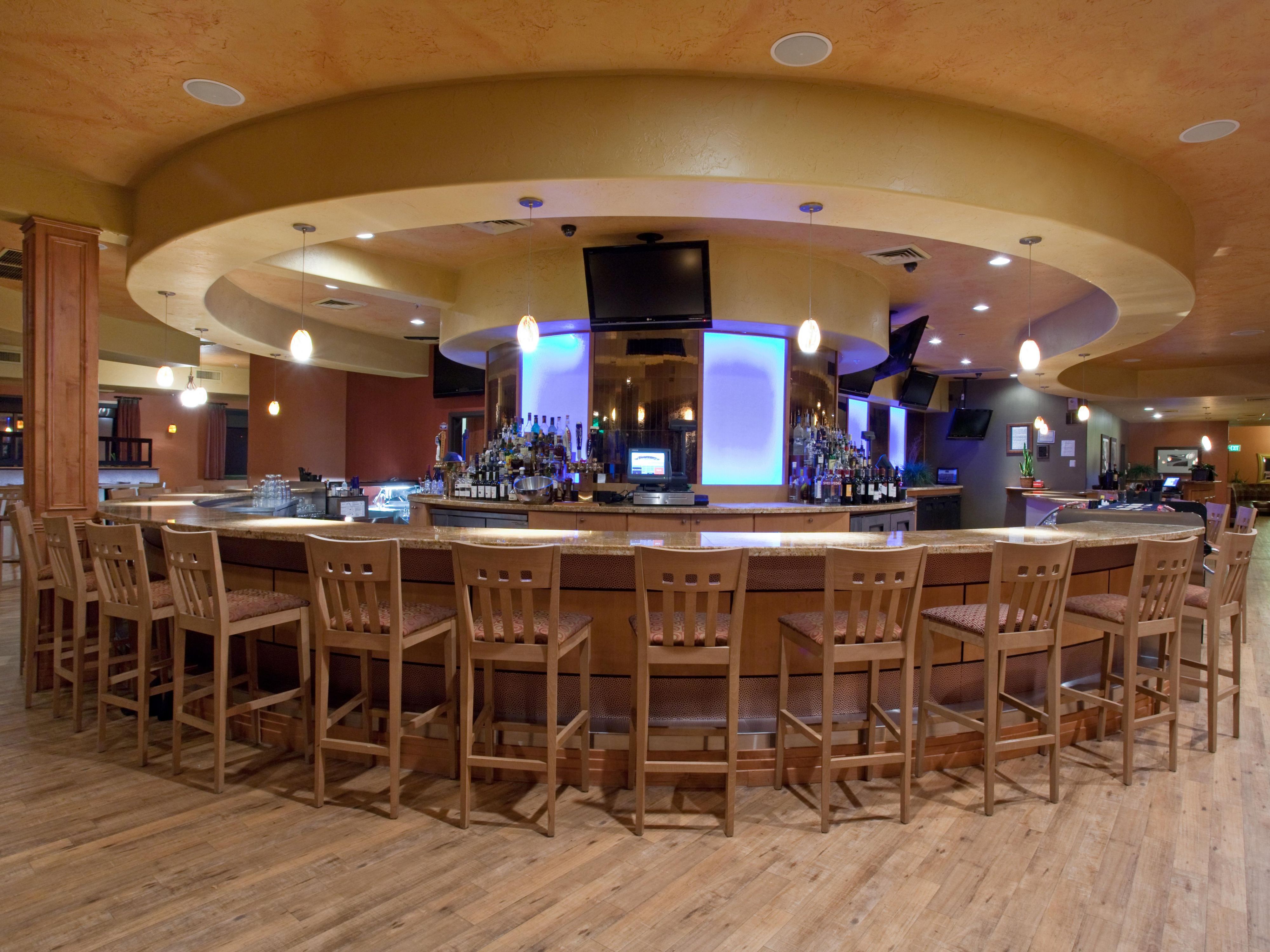 Trapper's Bar & Grill is conveniently located on the 4th floor of Holiday Inn Parker. Trapper's is known in Parker, Co for their Volcanic Hot Rock "Sear it Yourself" steaks and the amazing view of the mountains. 