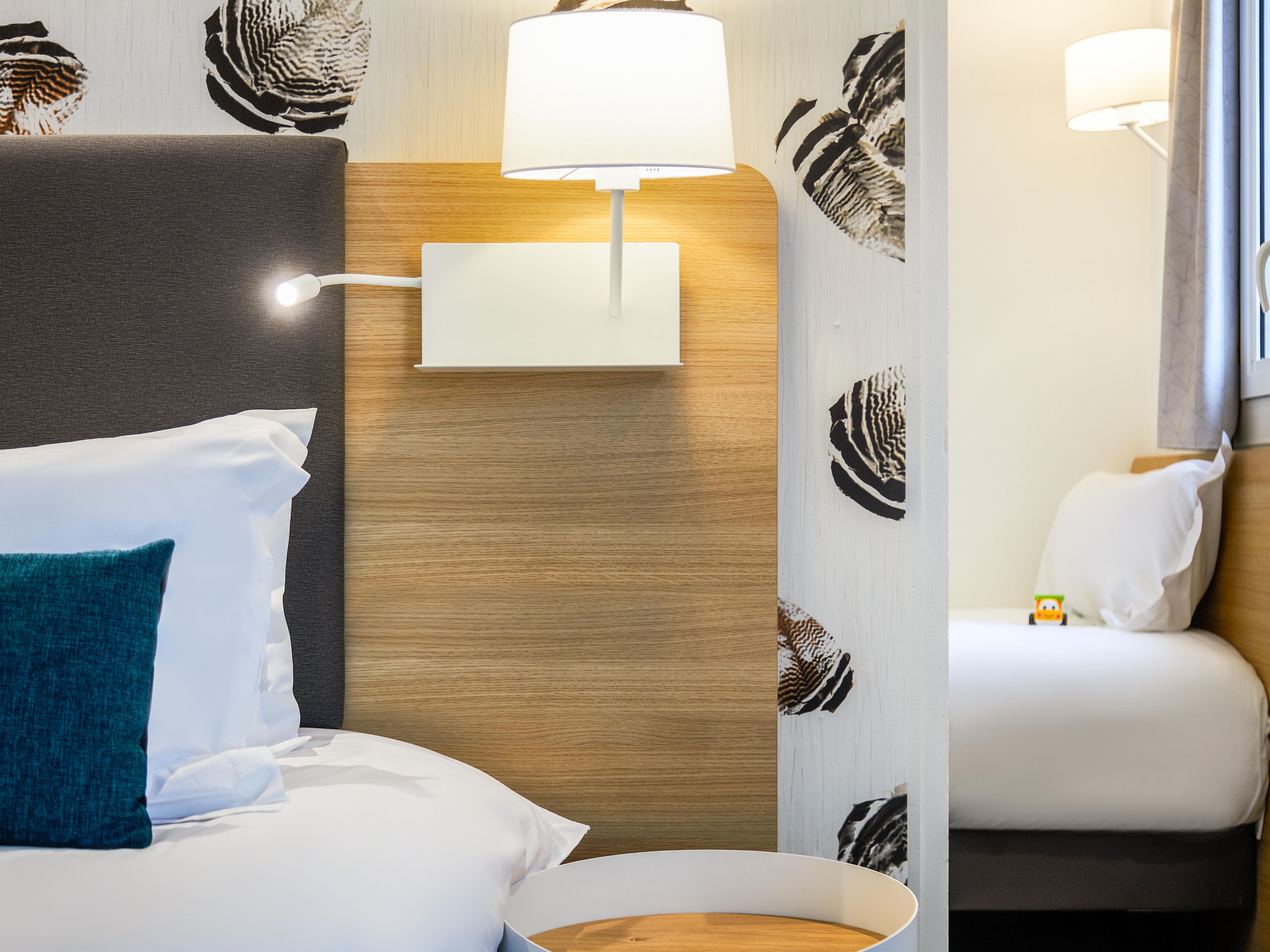 Our family rooms are perfect for comfy and fun family breaks, whatever the occasion. 
In our family rooms, you can enjoy a super-comfy kingsize bed for the grown-ups, and two separate beds for kids. Those rooms are separated by a door, so you can keep an eye on the kids and still have a bit of time to yourselves, too. Just call your hotel directly.