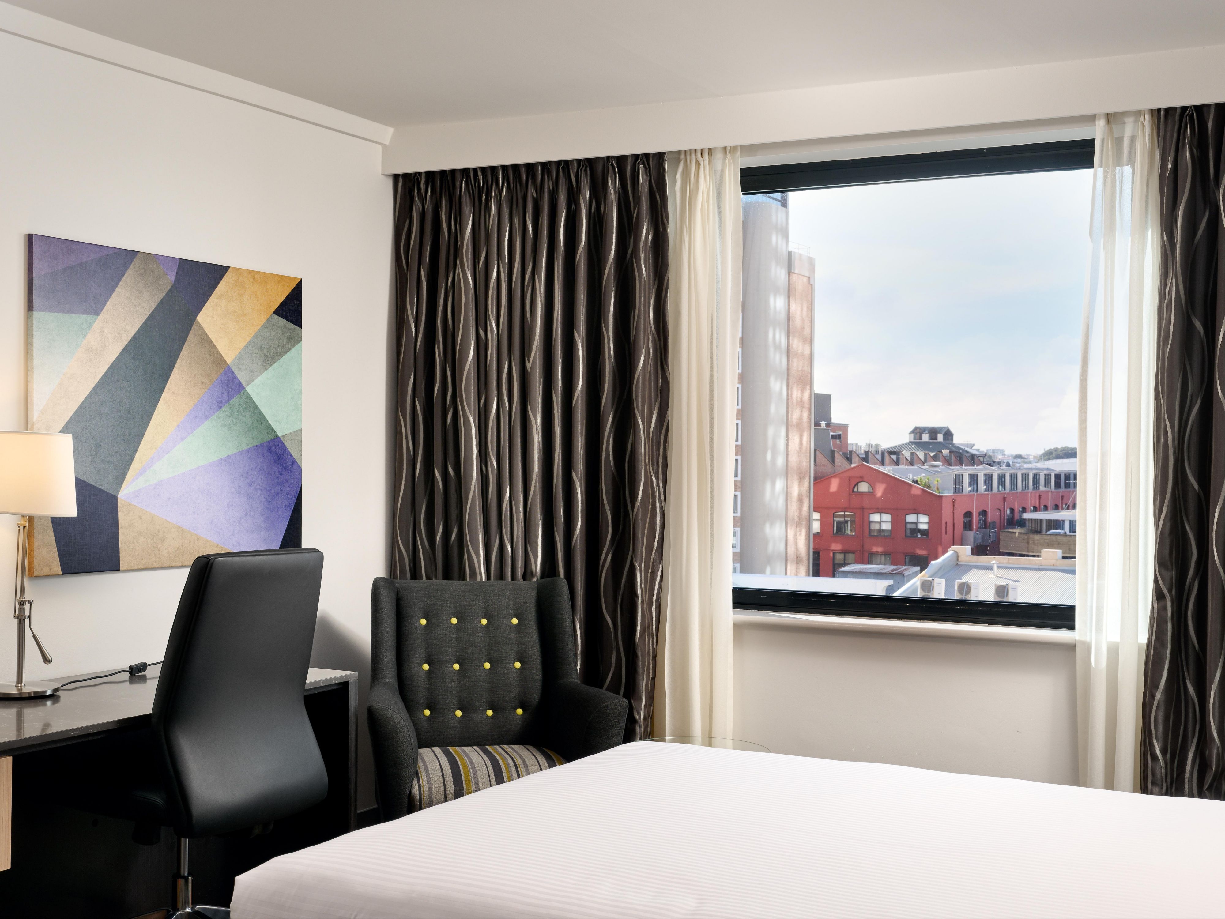 Our rooms offer the ideal balance of productivity and comfort. Enjoy a spacious work desk, high-speed Wi-Fi, and ample lighting to help you stay focused. After a busy day, recharge in a king bed, stream your favourite shows, or order a meal from Ivy & Jack without leaving your room.
