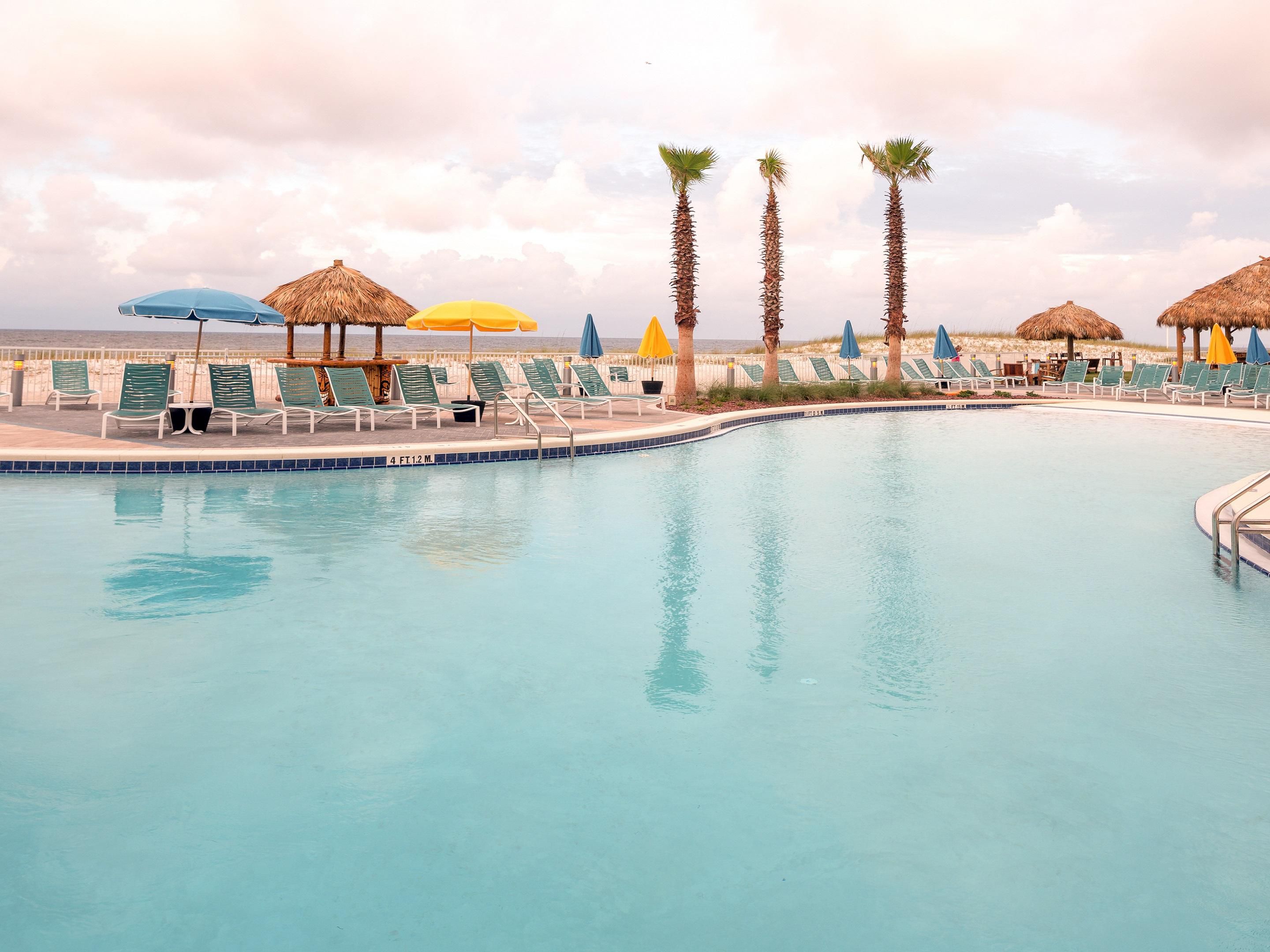 Lazy River and Zero Entry Pool - Heated when seasons are cool and refreshing when seasons are hot facing the sandy beach!  