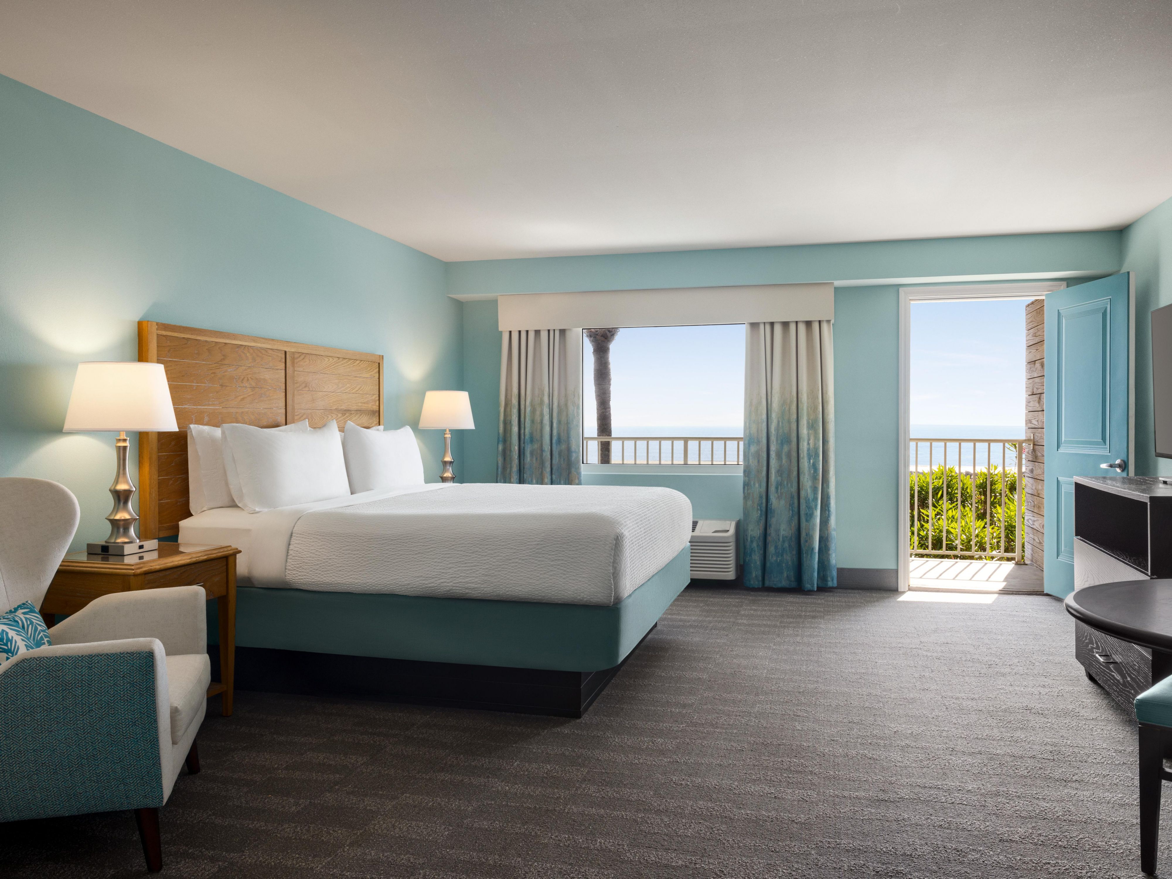 Experience the ultimate coastal getaway in our Ocean View Rooms featuring your own private patio or balcony, where every moment is framed by breathtaking views of the Atlantic Ocean. Nestled just steps away from both the poolside oasis and the pristine shoreline, this plush oceanside retreat offers a seamless blend of relaxation and adventure.