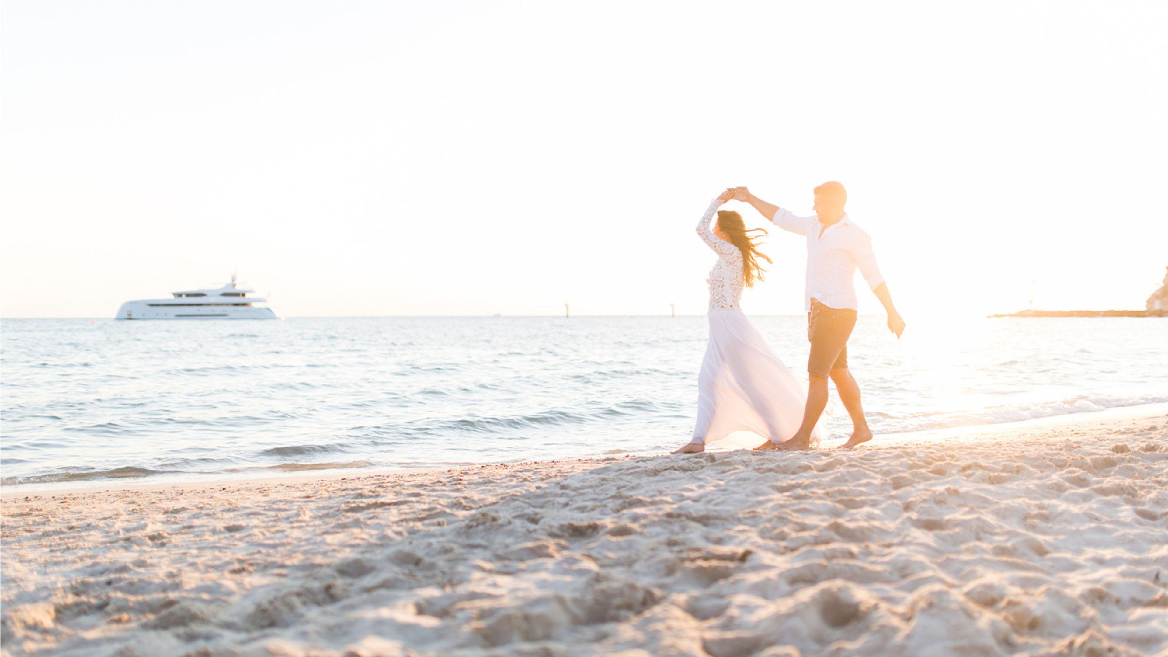 Couple walking along the beach