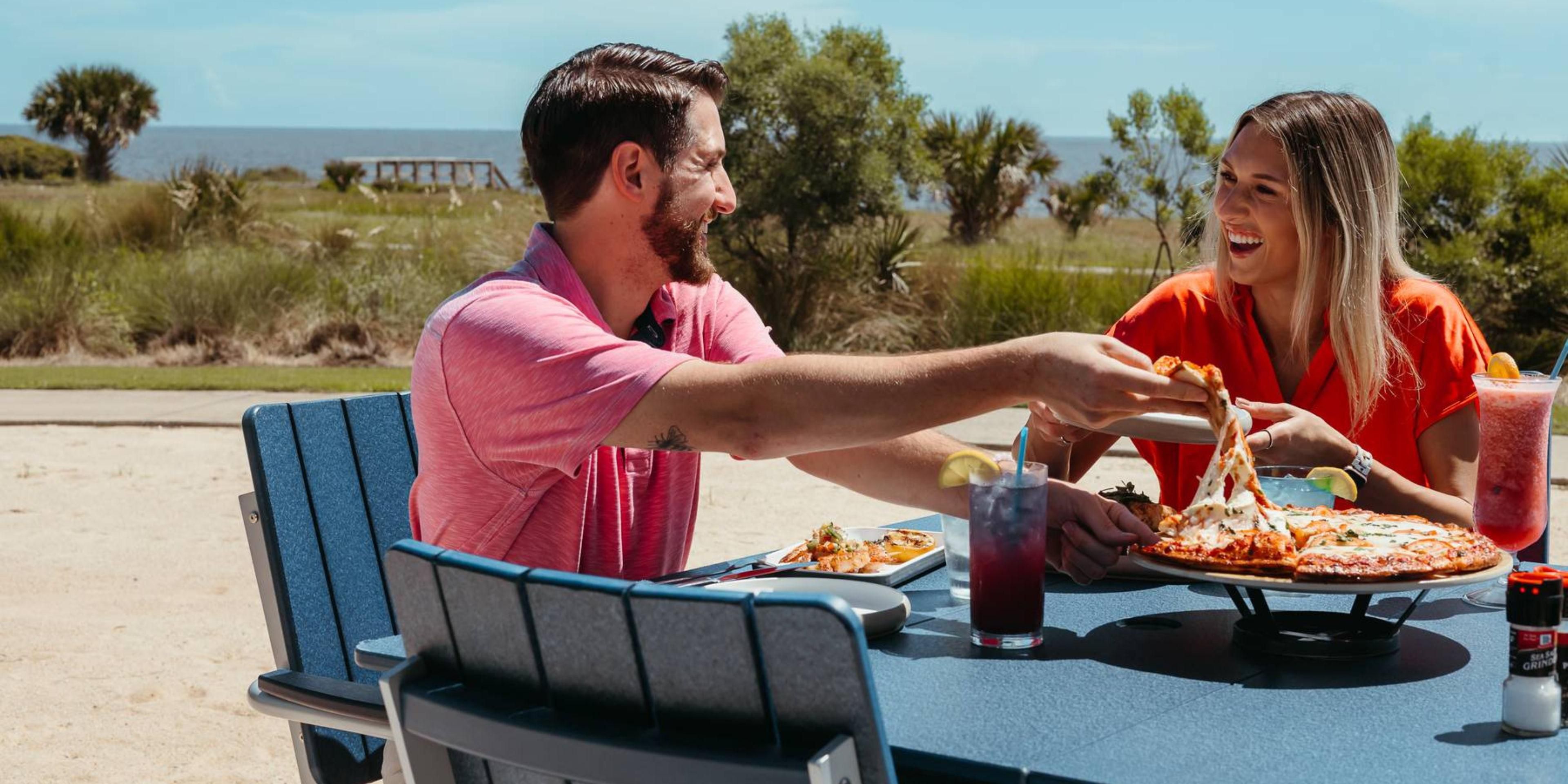Guest enjoying meal at 24 Coastal Grill