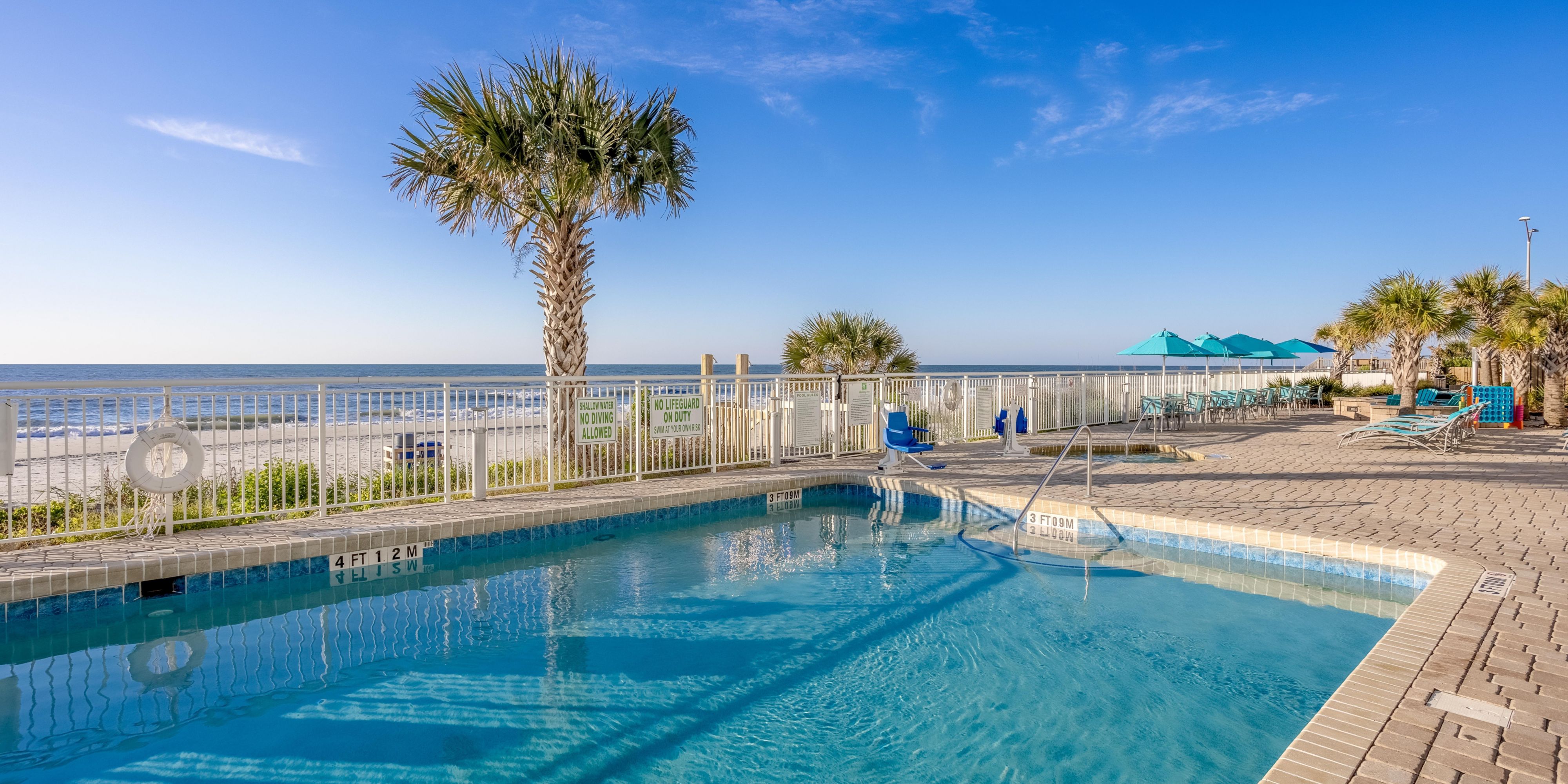 Take a dip in the pool after a day on the beach