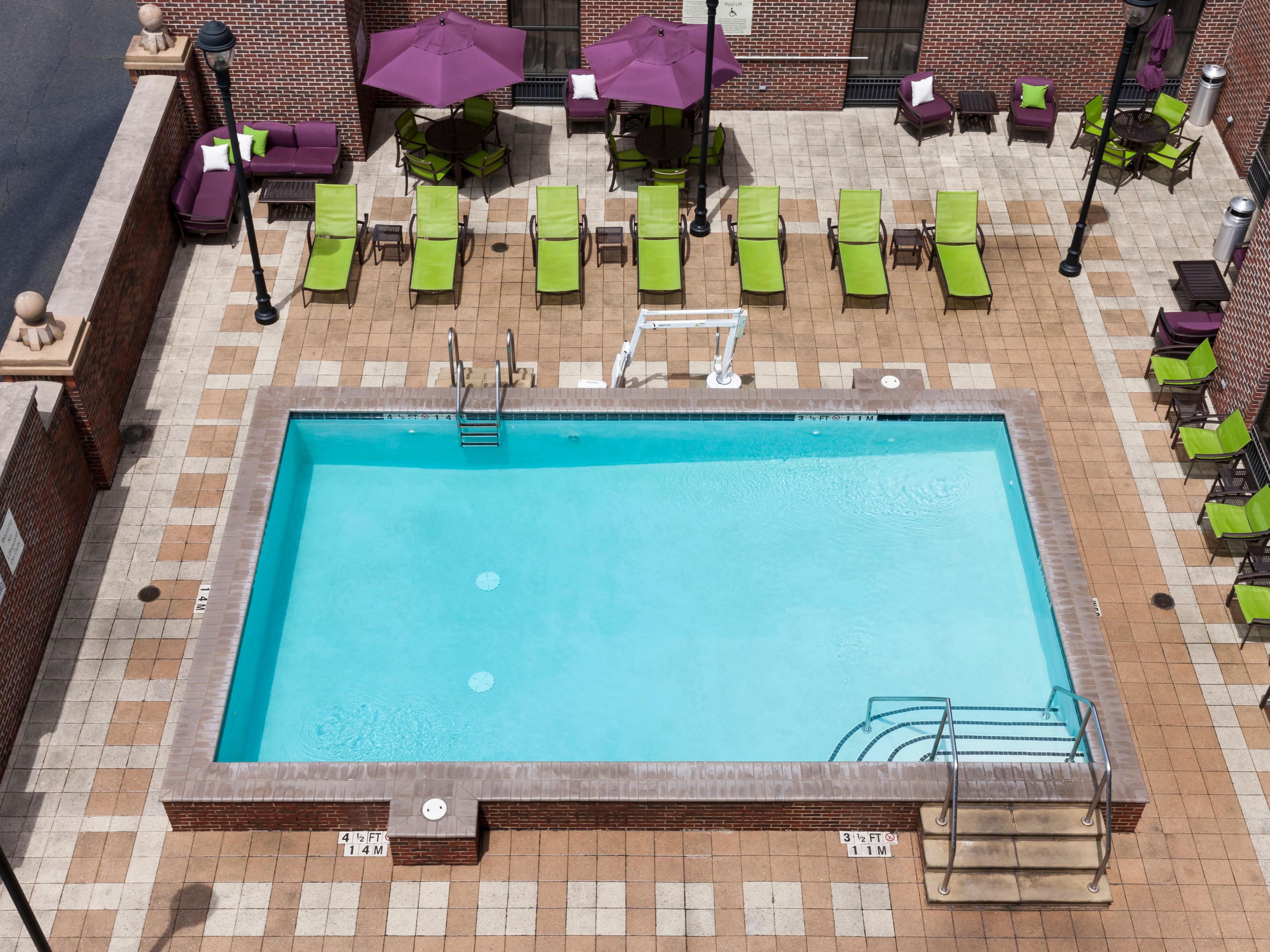 Splash around in the pool or relax in a luxurious lounge chair