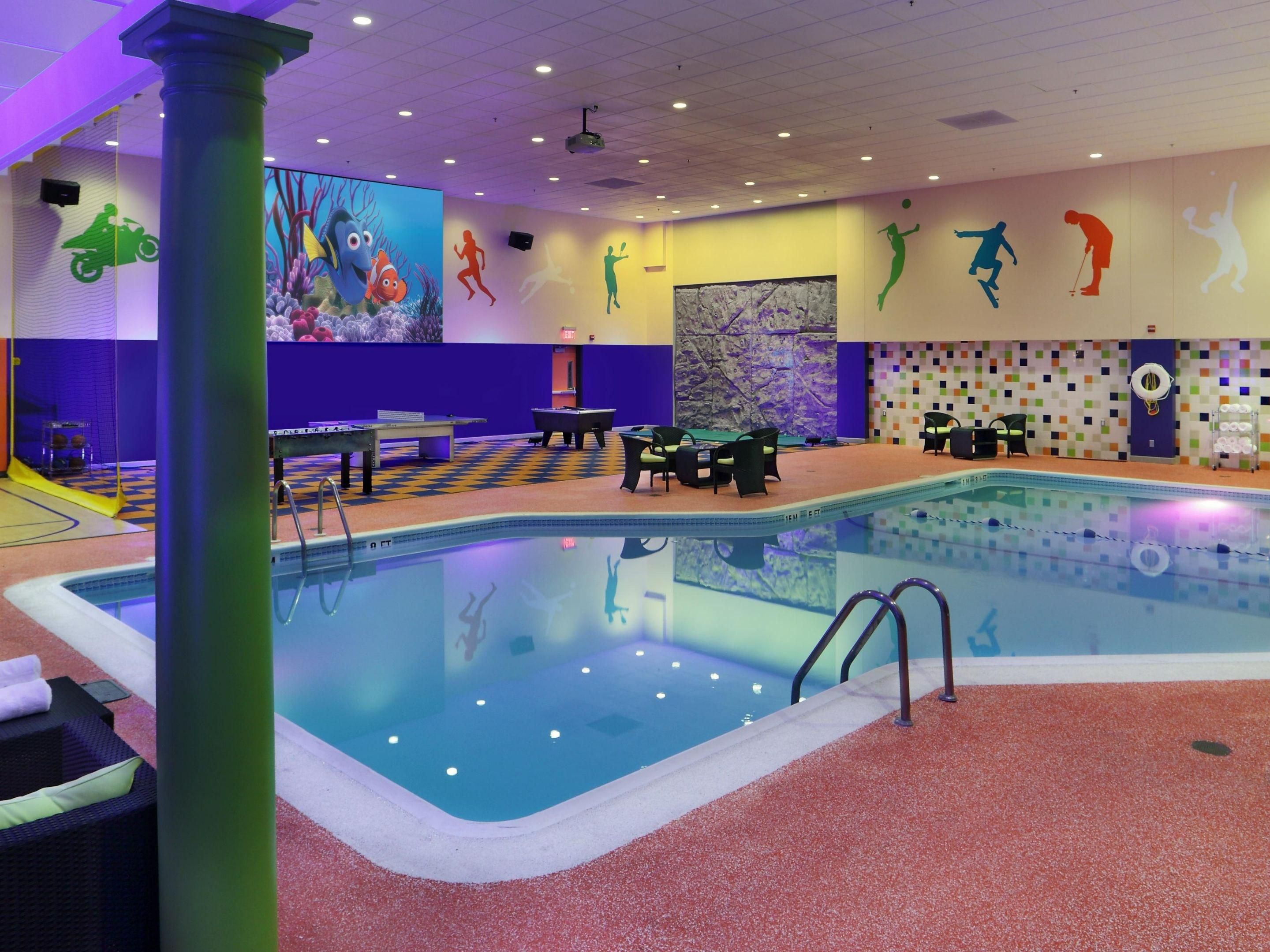 Make a splash with our Family Getaway Package! Enjoy unlimited access to our indoor pool and sports deck, plus free parking, breakfast for two adults, and kids eat free. Try the rock-climbing wall, foosball & basketball court. Unforgettable memories await! Hours: Mon–Thurs, 8 AM–12 PM, 4 PM–9 PM; Fri–Sat, 8 AM–12 PM, 4 PM–10 PM; Sun, 9 AM–10 PM. 