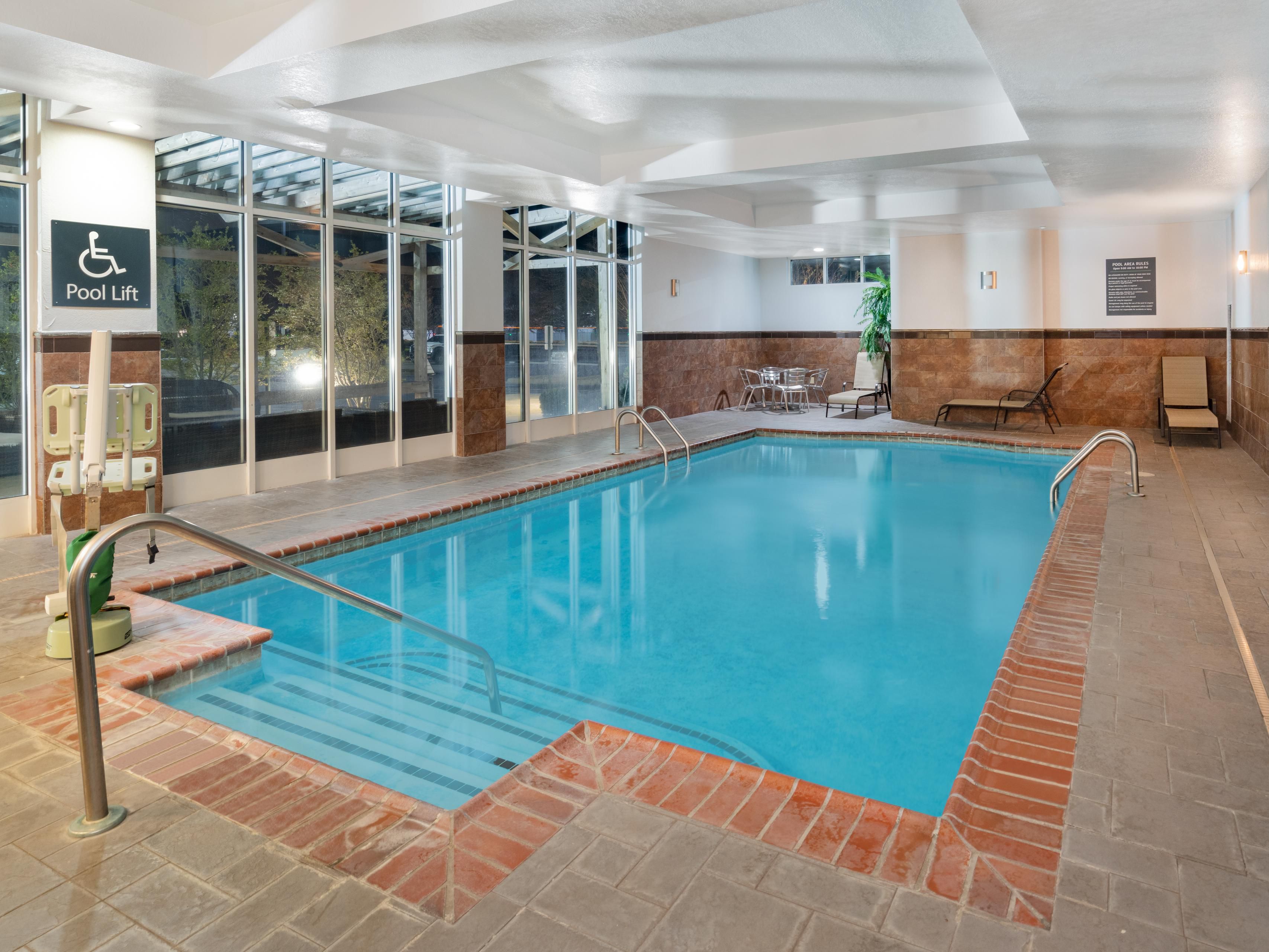 Unwind with a refreshing dip in our indoor heated pool. Start your day with invigorating laps or unwind in the evening with a soothing swim. Soak in the sun on our outdoor patio with comfortable lounges or fire up the grill to enjoy a picnic lunch or dinner under the stars. Our pool and outside patio provide a peaceful and enjoyable retreat.