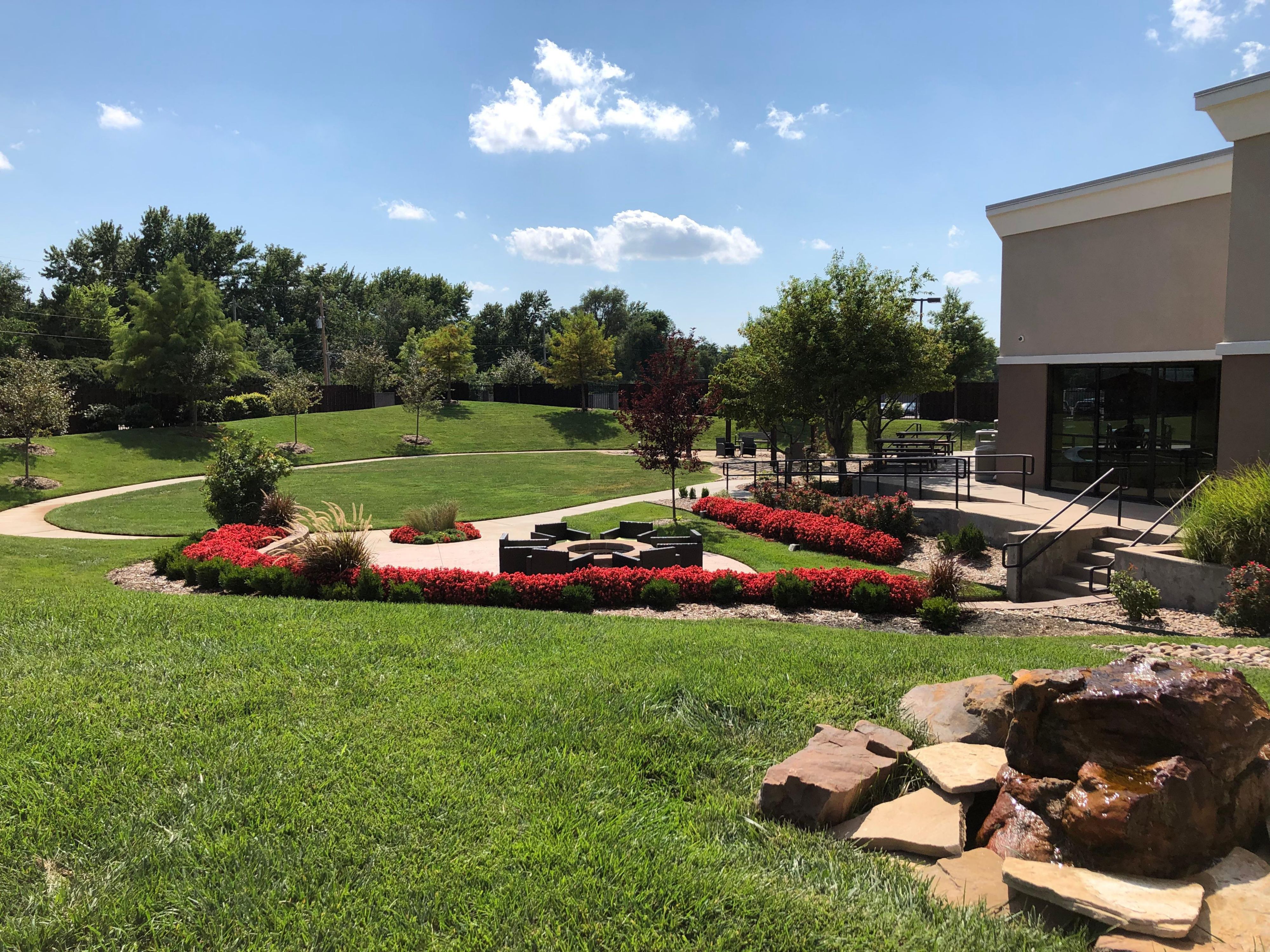Come enjoy a nice relaxing evening in our Blue Cedar Terrace. Enjoy the luscious green area with a variety of colorful plants and flowers.  When the sun is down stay warm next to the fire pit or when the sun is up enjoy the shade of our pergola. 