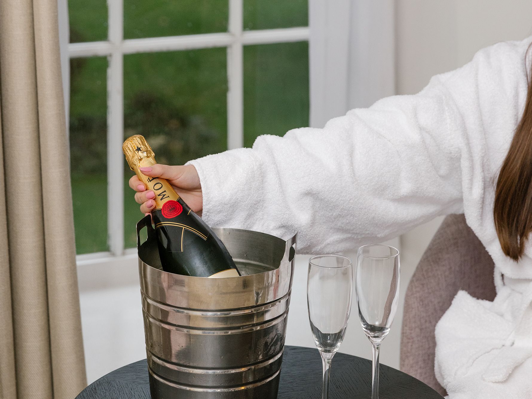 Guests pulling champagne out of ice