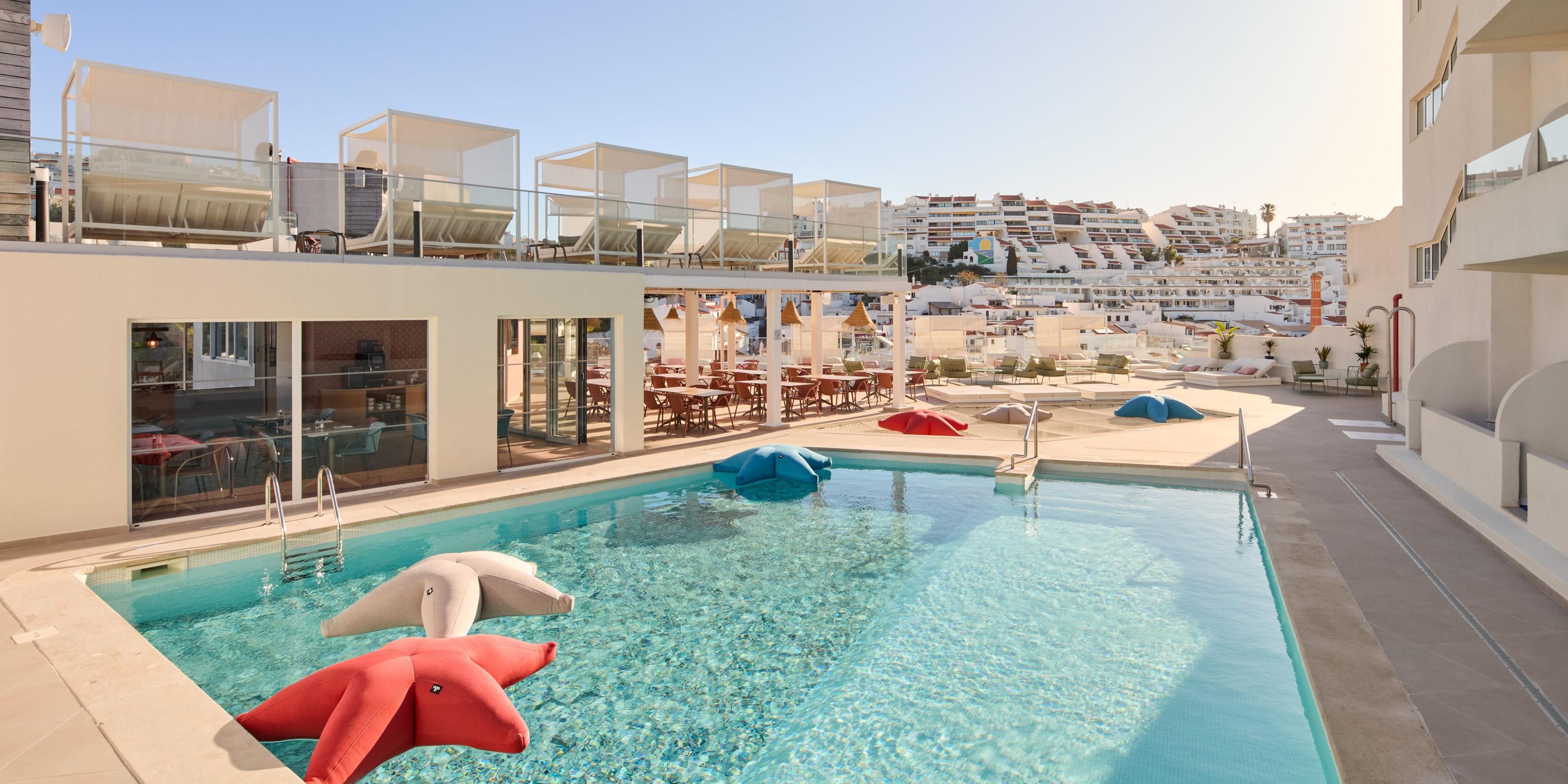 Take a dip in our chic outdoor swimming pool