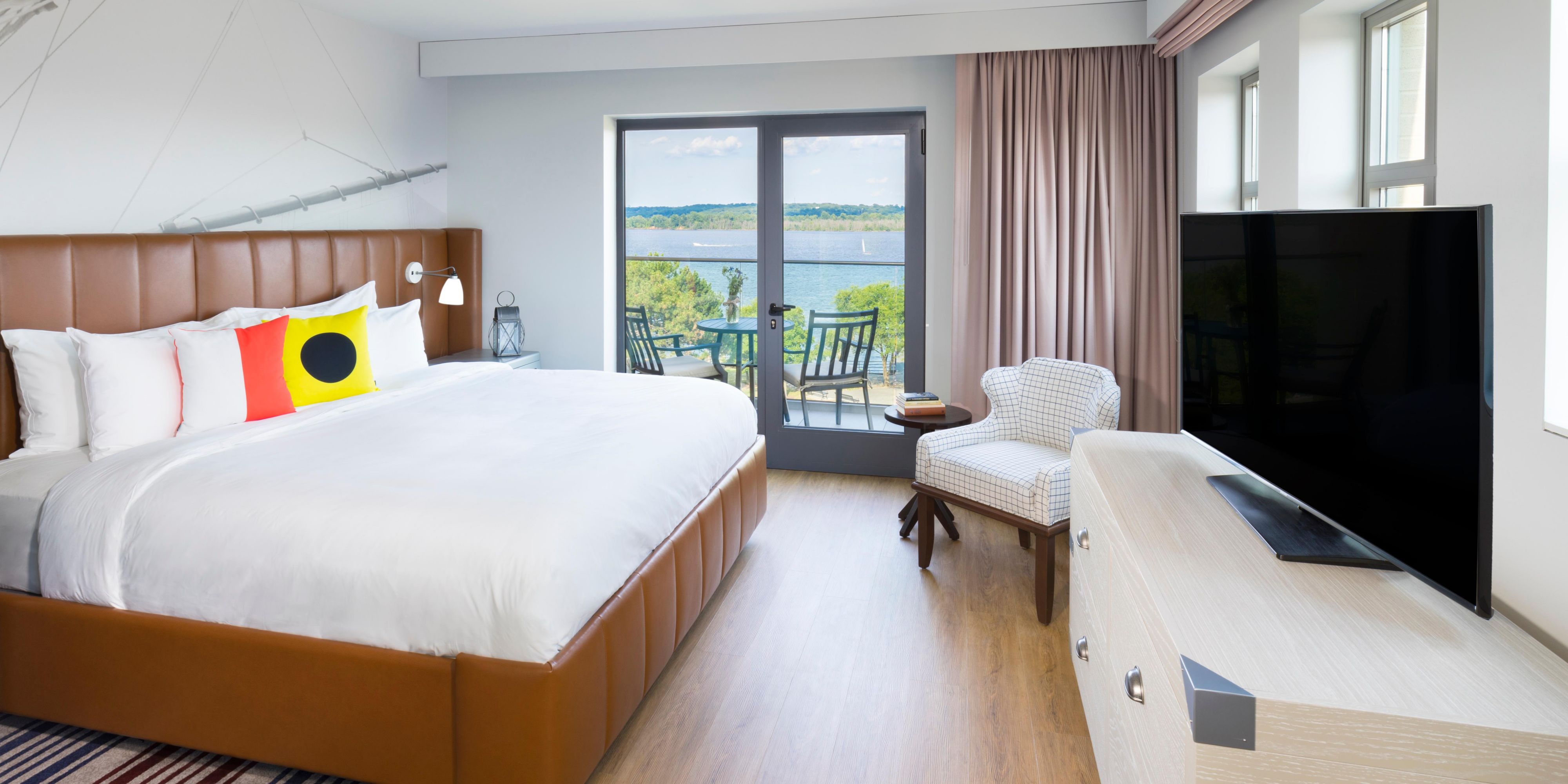 Enjoy beautiful views of the river from your balcony room