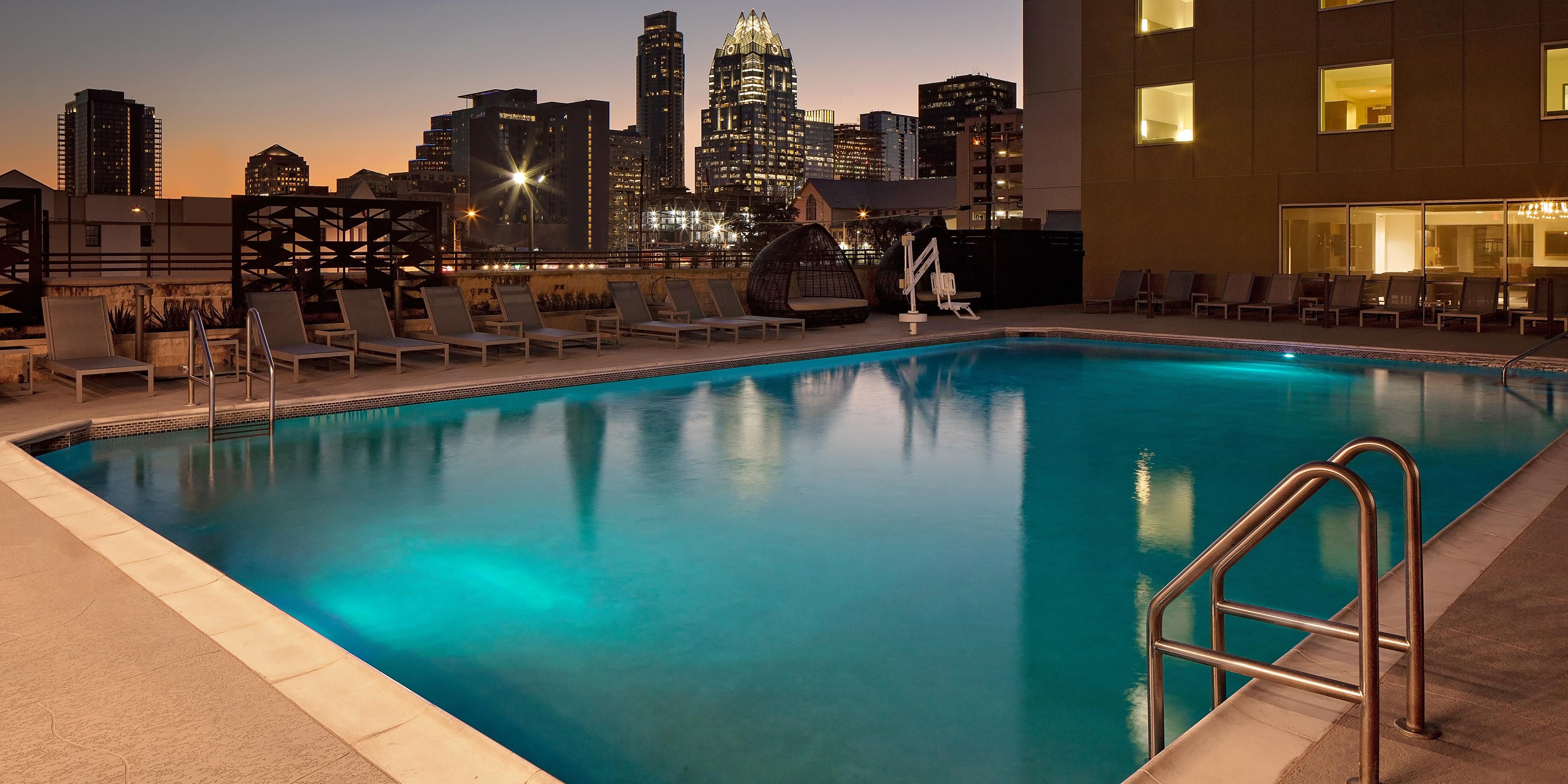 Cool off with skyline views at our Austin hotel rooftop pool.