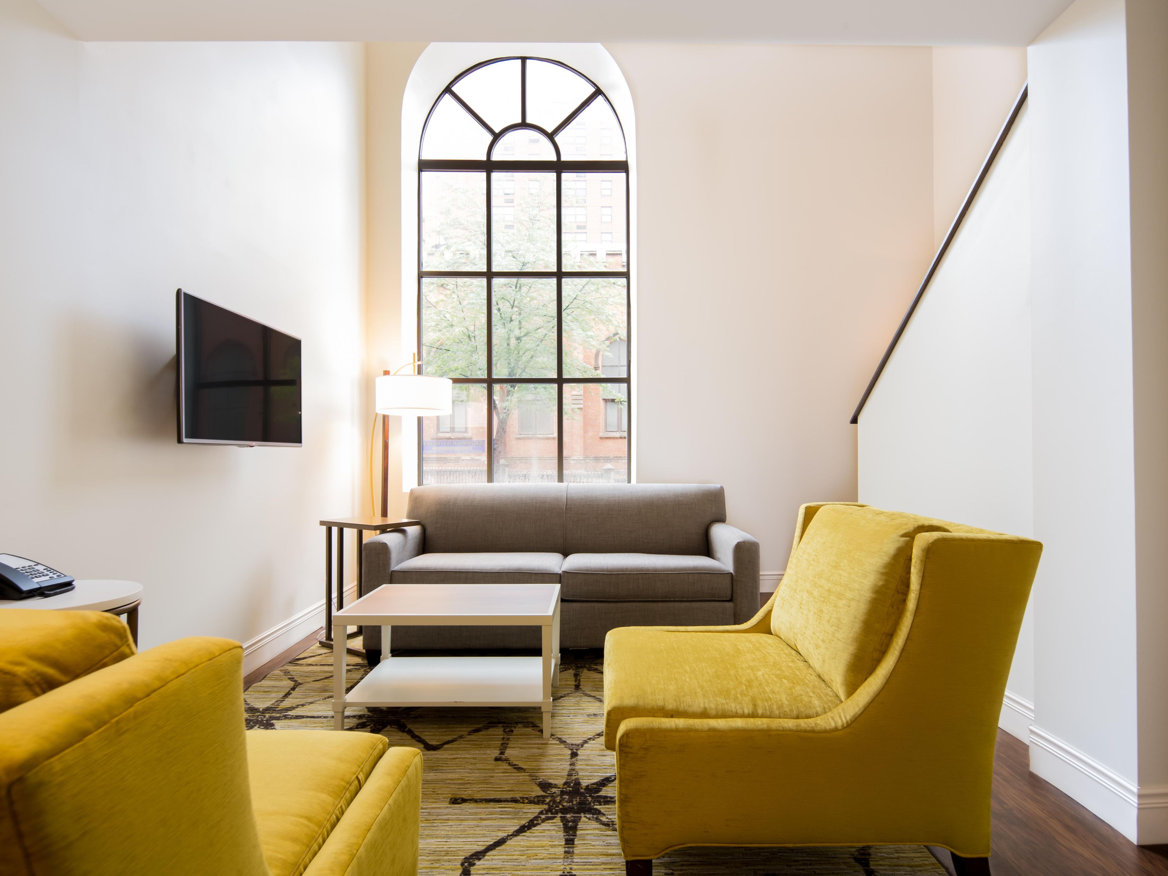 Elevate your stay with our bi-level suites, offering separate living areas, wet bars, and sweeping city views. These expansive accommodations combine residential-style comfort with boutique flair, ideal for extended visits or small group getaways.