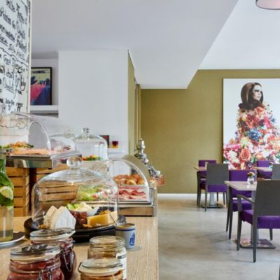 Freshly baked breads, pastries, cheeses and juice for breakfast.