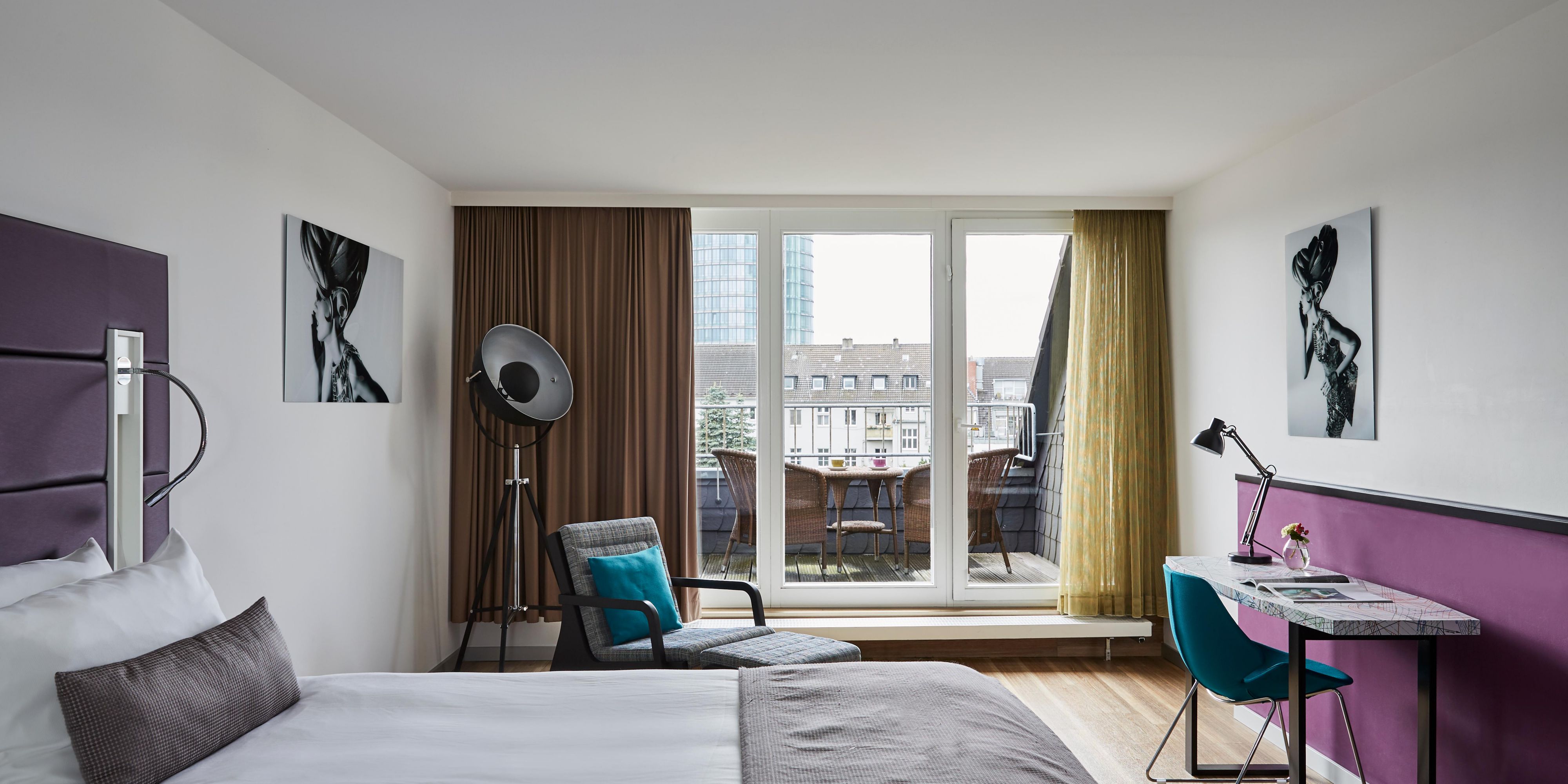 A balcony with seating in a spacious King Superior room.