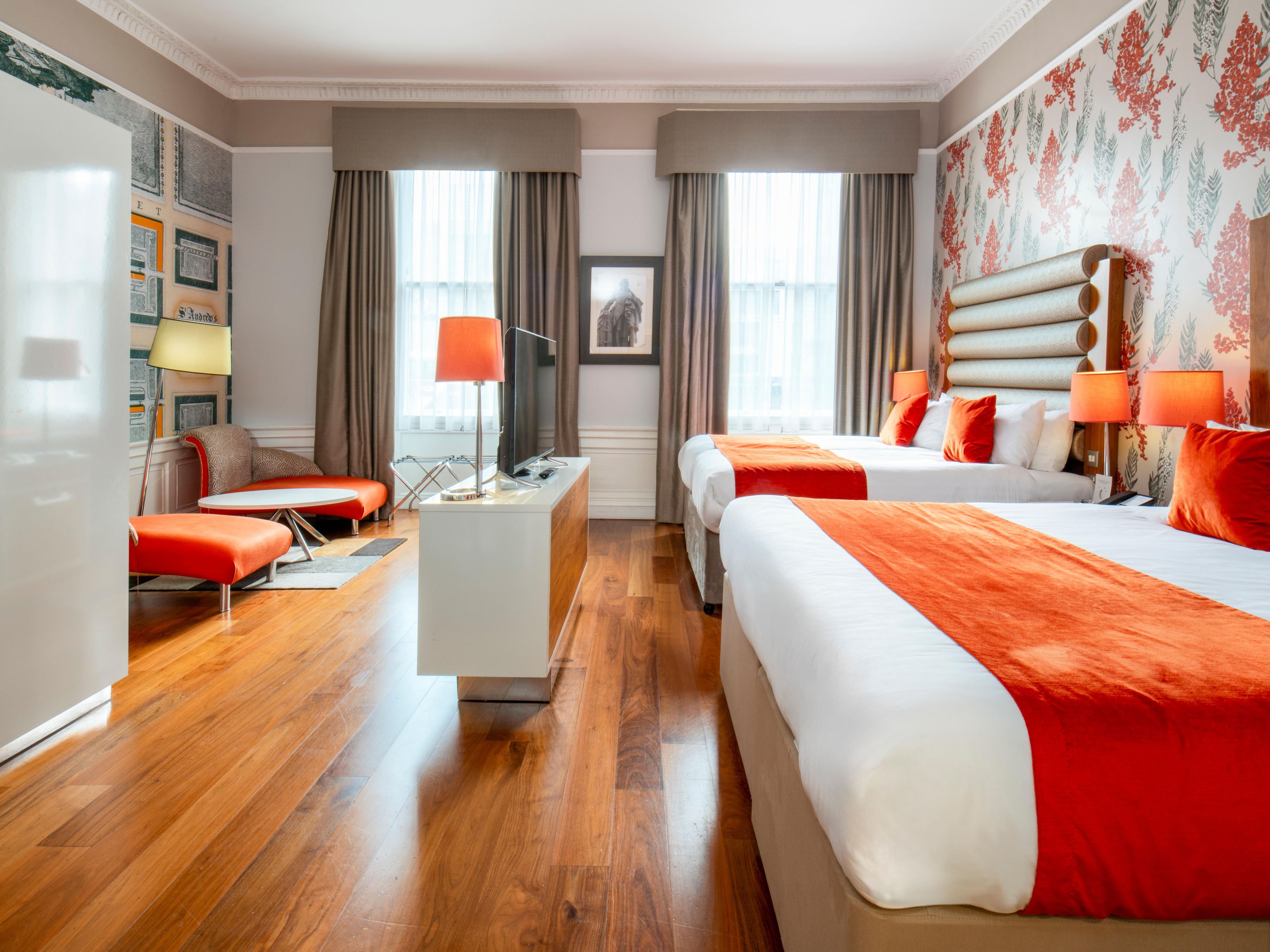 Immerse yourself in a boutique experience like no other. Our hotel boasts uniquely designed rooms, each offering a personalized touch that sets us apart from ordinary chain hotels. Discover a theater-inspired ambiance in our public areas, and a special partnership with the zoo, featuring two exclusive Giraffe-themed suites.