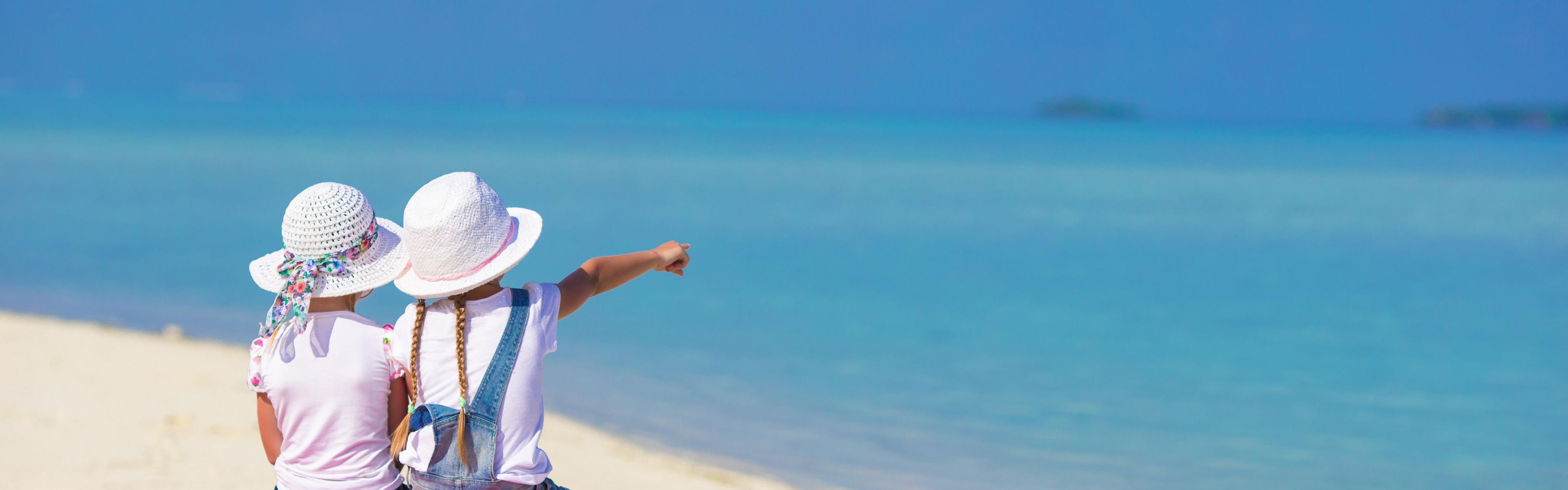 Children looking at Grace Bay Beach