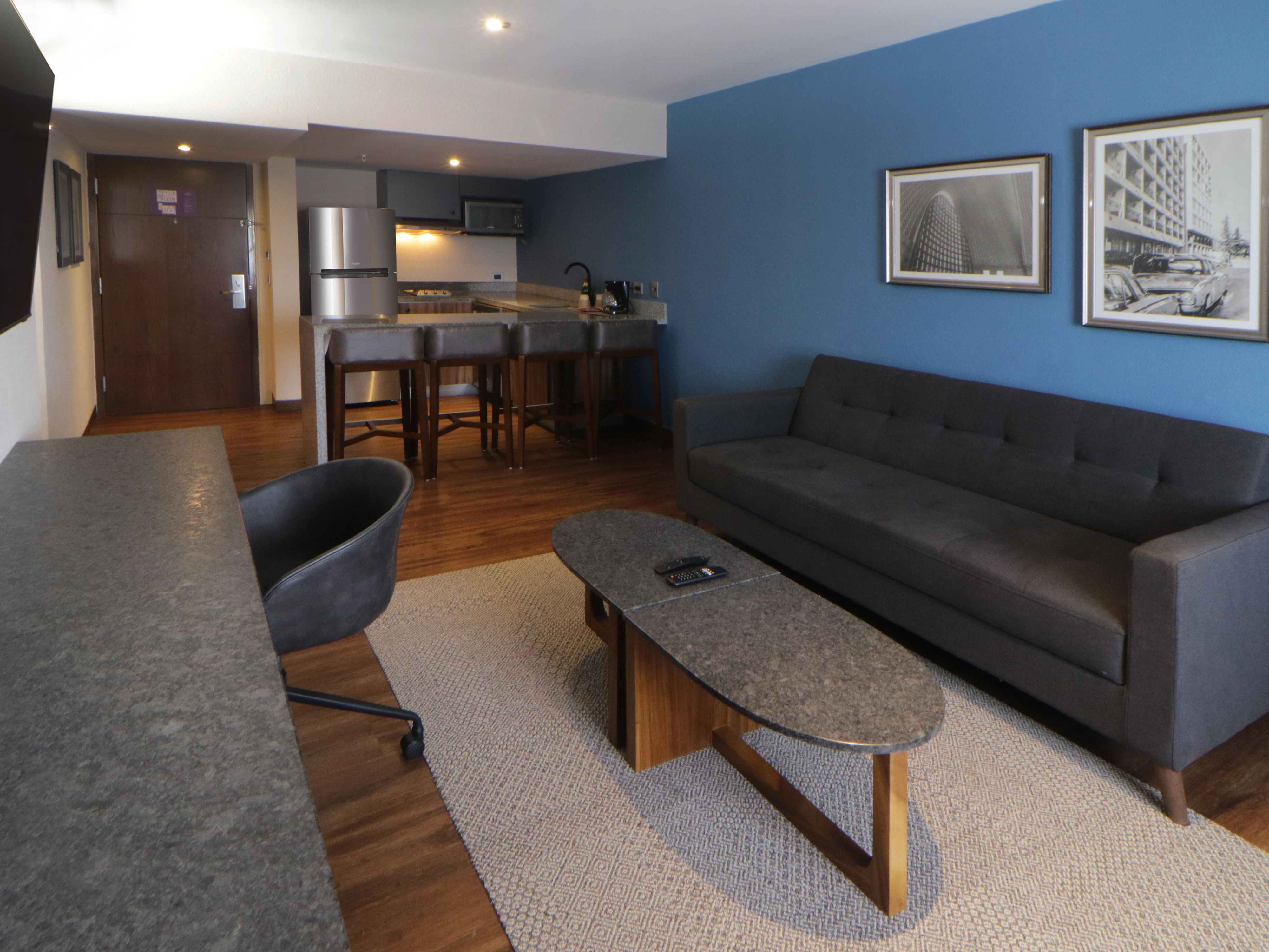 Enjoy the comforts of home in our spacious suites at Hotel Indigo Guadalajara Expo. Thoughtfully designed for long-term stays, our suites offer separate living areas, fully equipped amenities, and stylish touches to make your stay as comfortable as possible. Experience Guadalajara with the luxury of extra space and convenience.