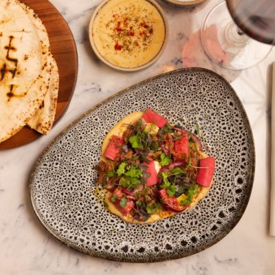 Our signature Banksia Hummus served at your table