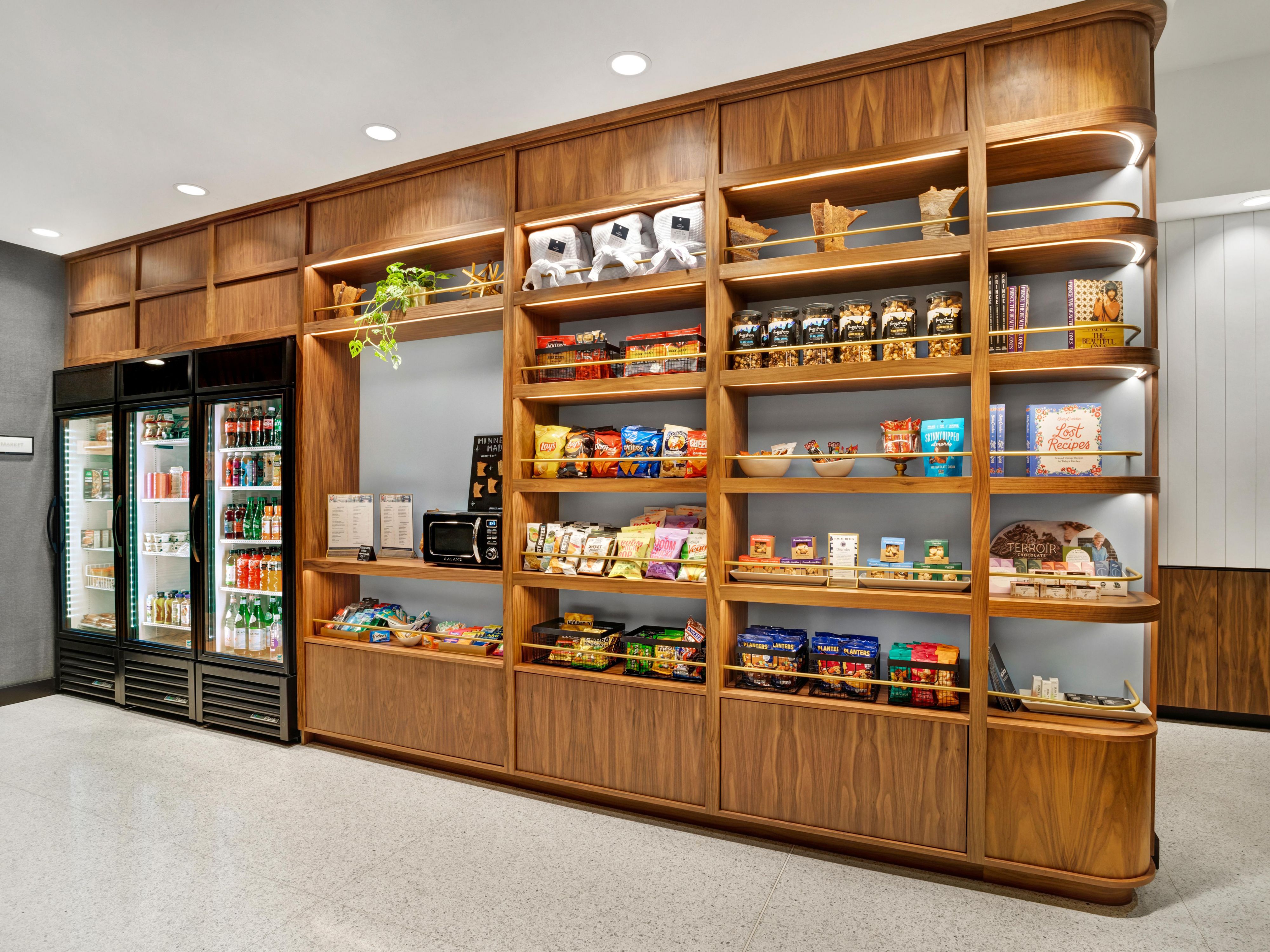 Discover local flavor and flair at our onsite market, featuring curated local snacks, fresh grab-and-go bites from our restaurant, and unique souvenirs crafted by Minnesota artists. Whether you're craving a quick bite or the perfect keepsake, it's all just steps away, thoughtfully selected, and locally inspired.