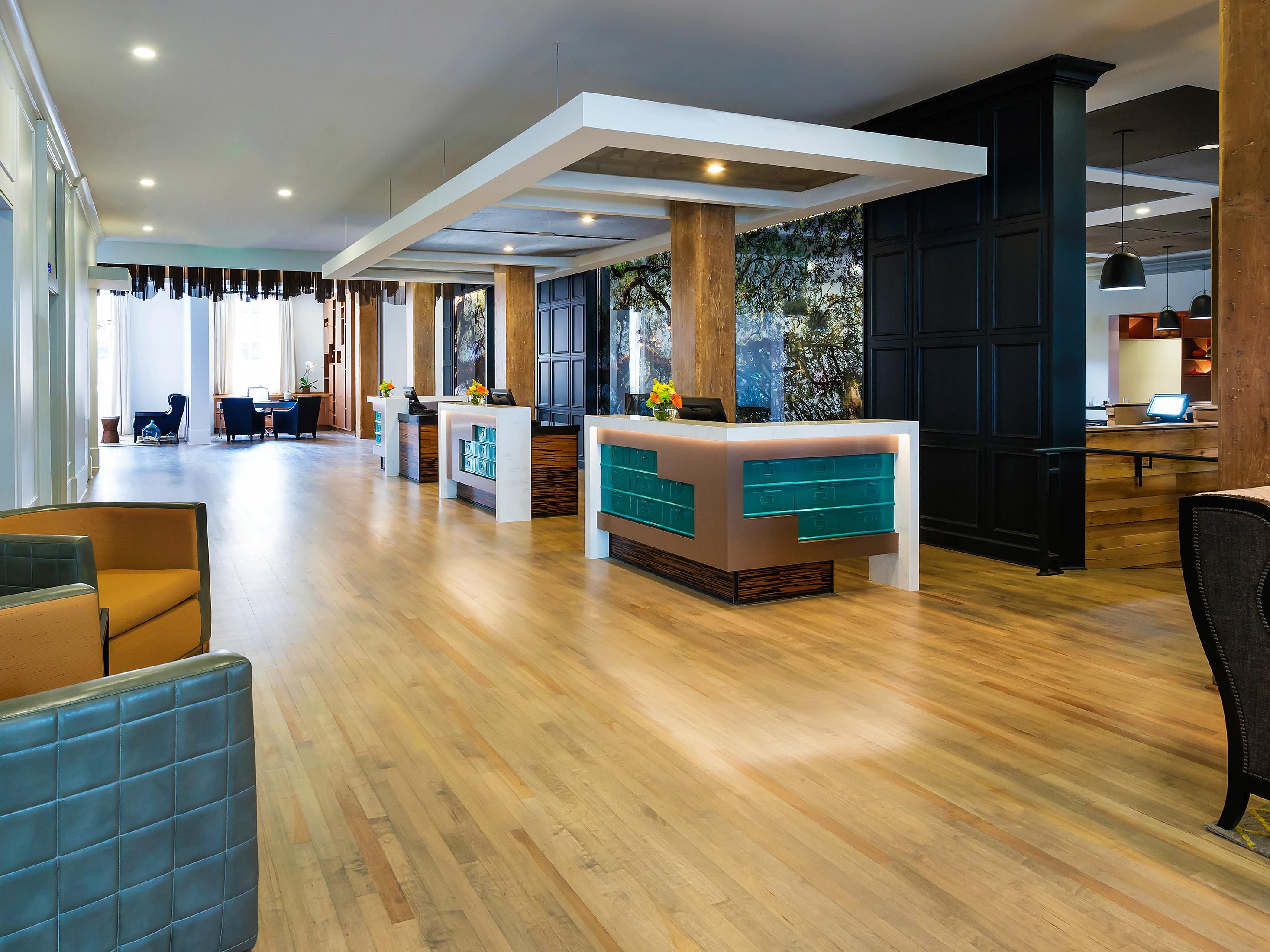 Inspired by the building’s history as a post office, the front desk showcases mailbox drawers. They are painted a rich blue in a nod to Savannah’s original indigo export! Vintage PO boxes also appear in the lobby corridor and the building's original wooden beams have been preserved throughout the lobby.