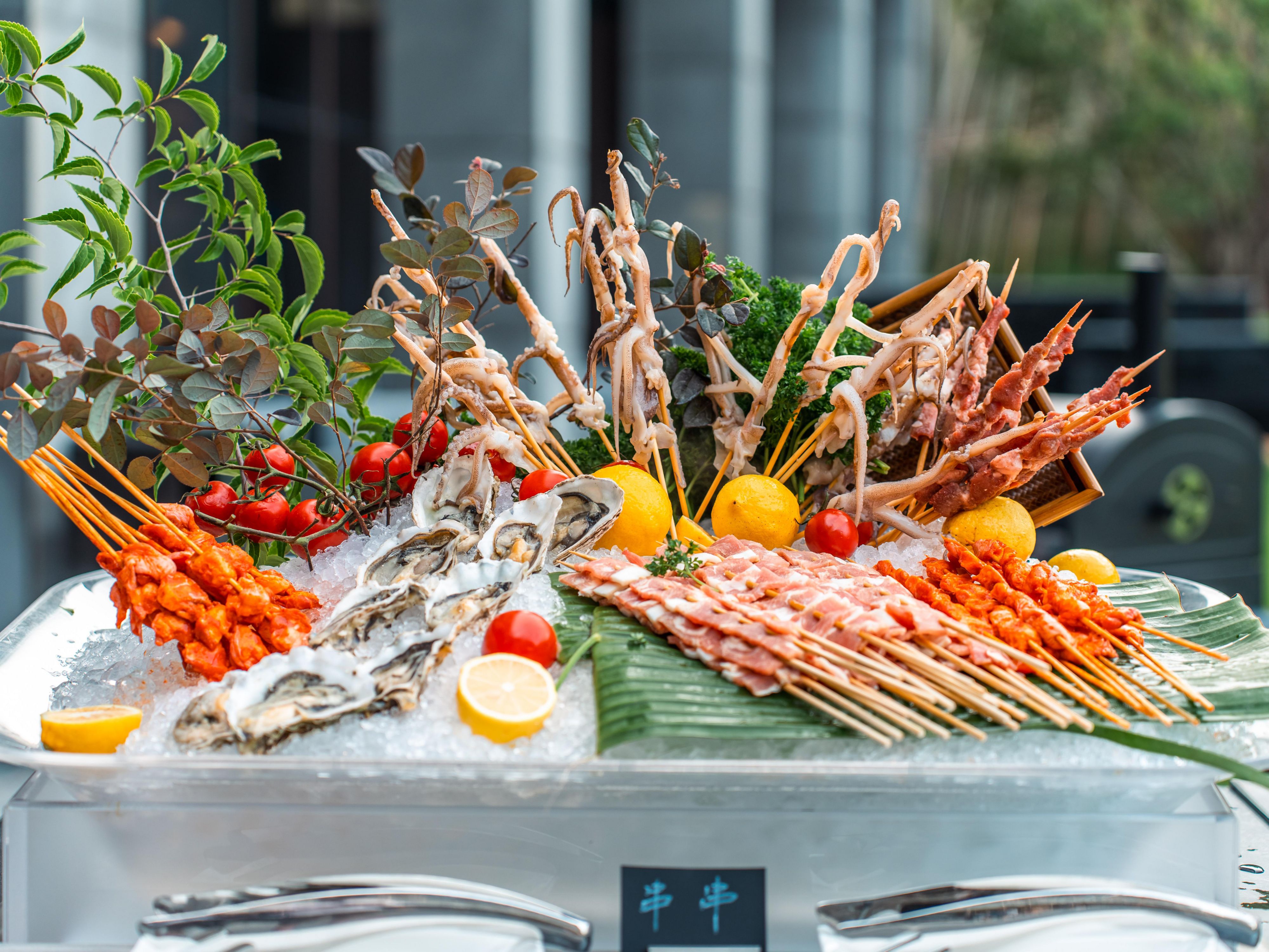 Indulge on a free flow of domestic beer, wine and soft drinks and a feast on the outdoor BBQ buffet with grilled meats and seafood, salad, dessert while you welcome in the summer evening.