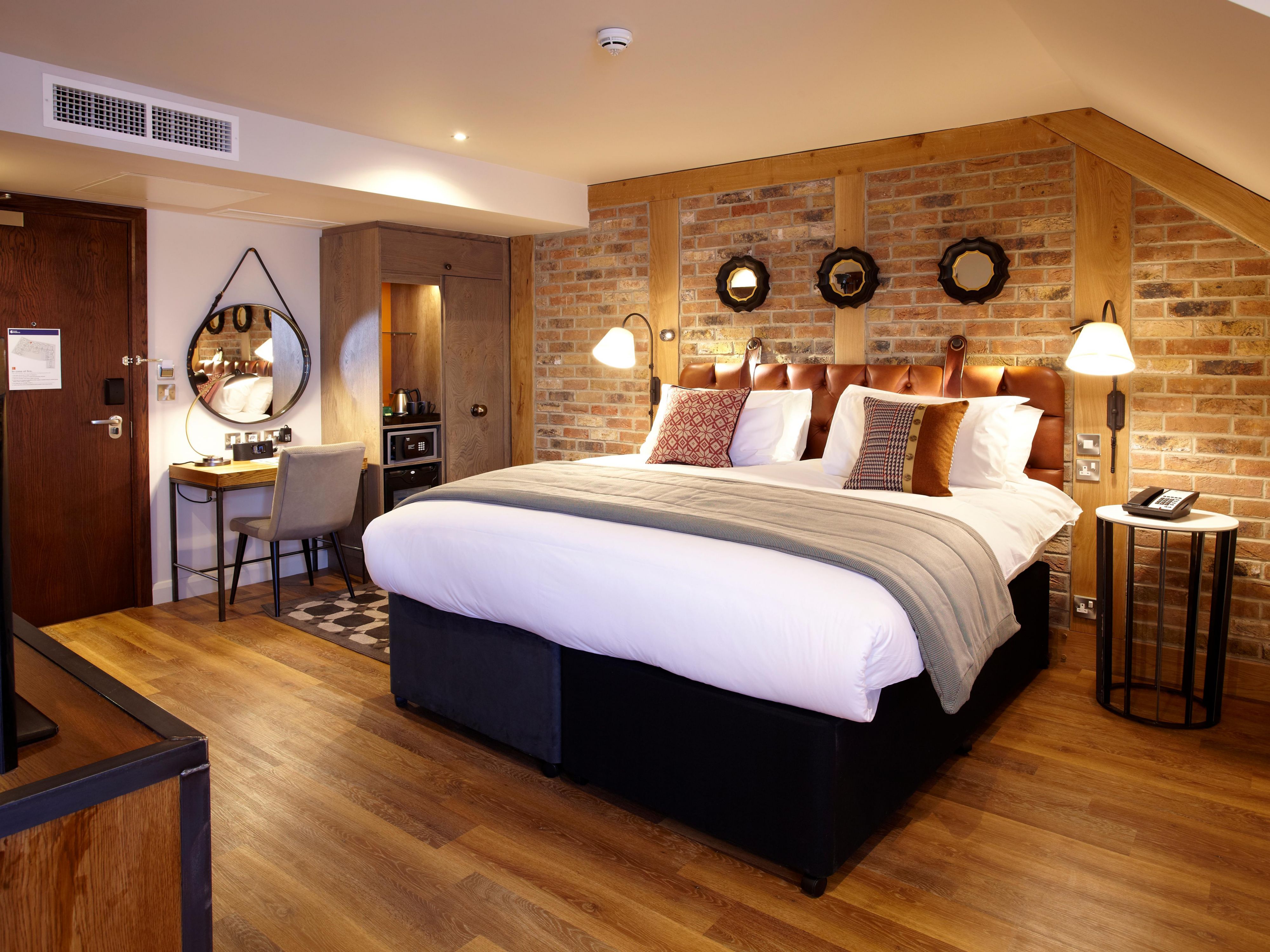 Feel at home in the luxury of our neighbourhood-inspired guest rooms, designed to reflect York’s rich history. Soft, Yorkshire wool furnishings and images from Walmgate past complement contemporary décor. Enjoy free Wi-Fi, a mini fridge, and air conditioning. Slip into a complimentary robe and enjoy a local  welcome gift.