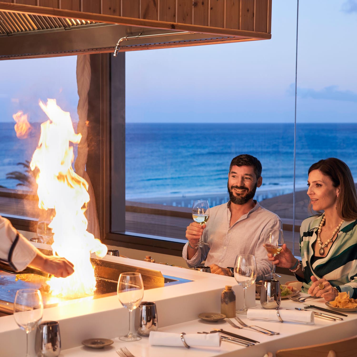 Couple enjoying dinner with a private chef