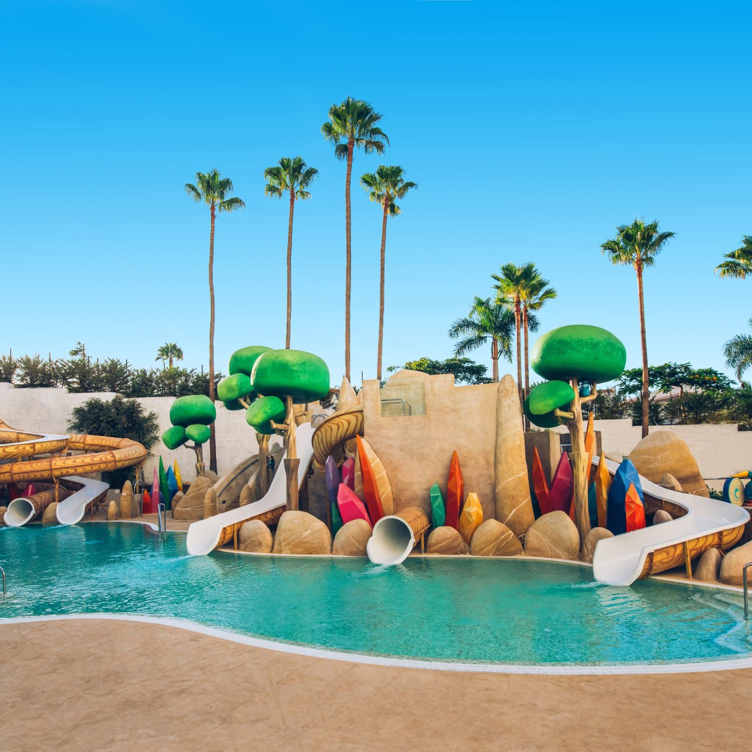 Poolside jungle gym with slides