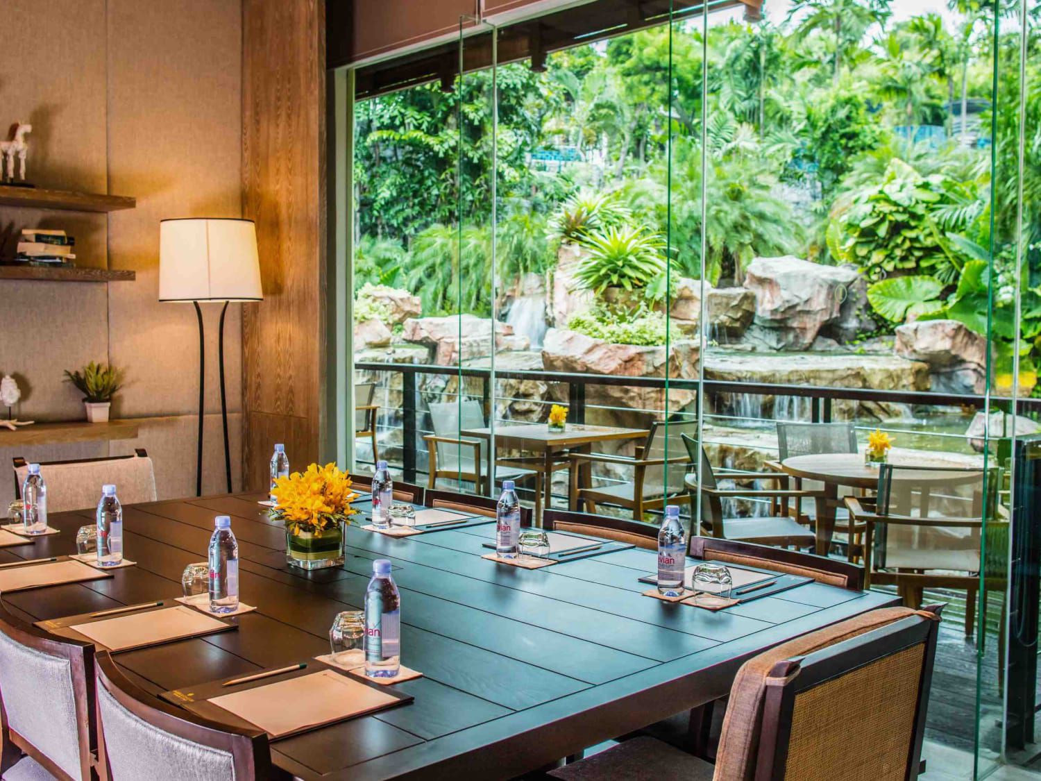 boardroom with view of waterfall feature in a tropical setting