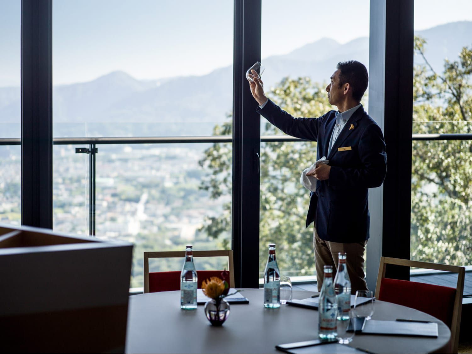 staff examines stemware in meeting room