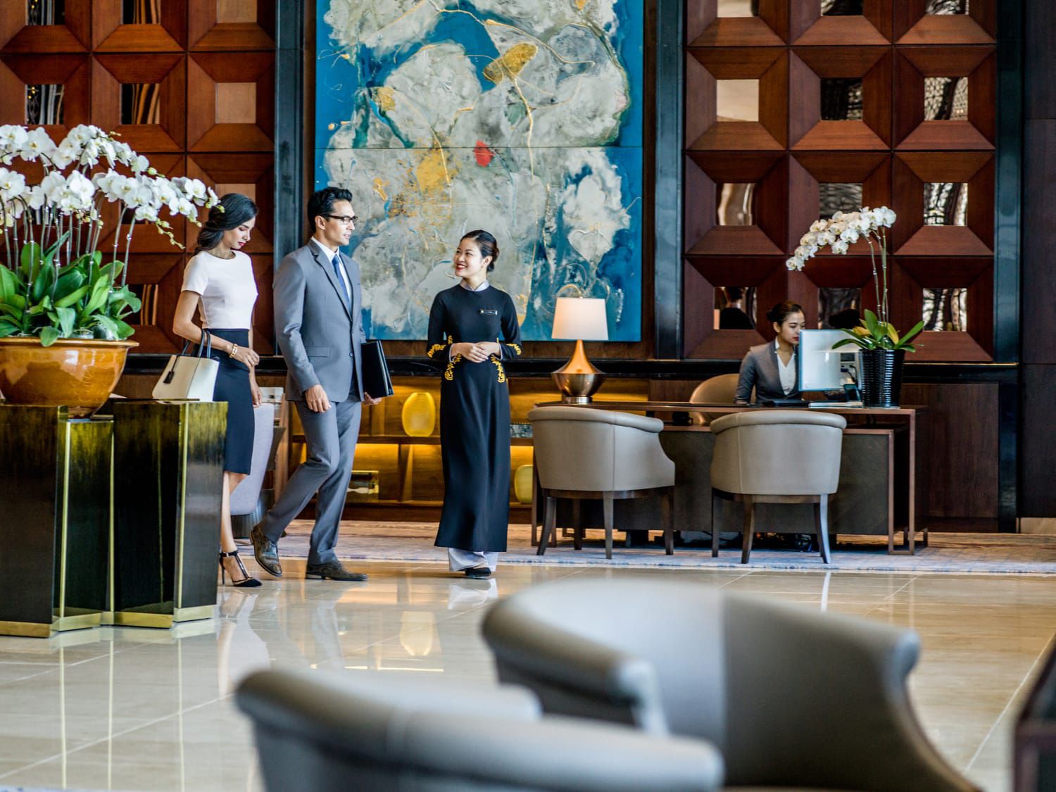 people standing in elegant lobby in conversation