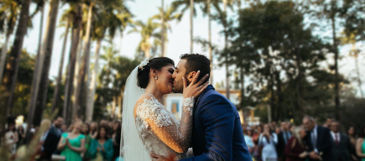 wedding ceremony with a couple kissing