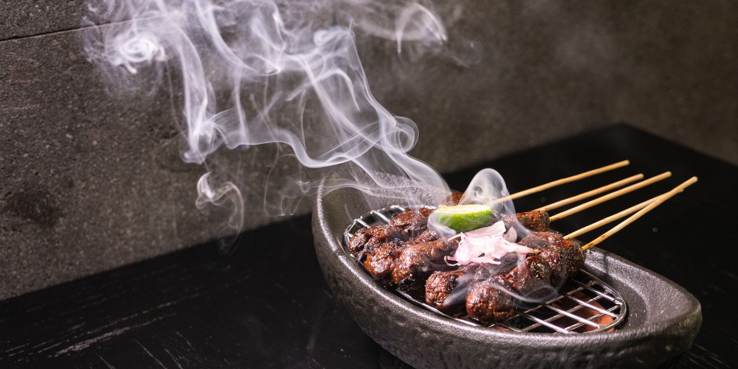 Sizzling grill meat skewers