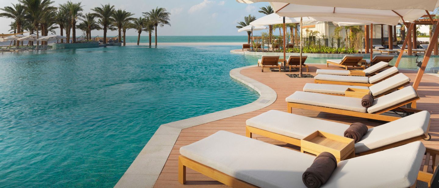  Chairs alongside an infiniti pool overlooking the ocean