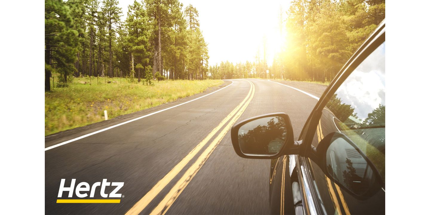 Car driving down winding road