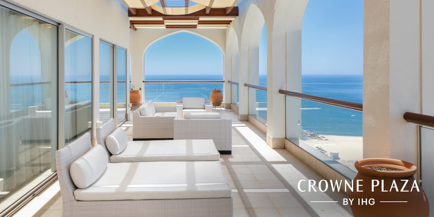 Large balcony overlooking clear blue ocean