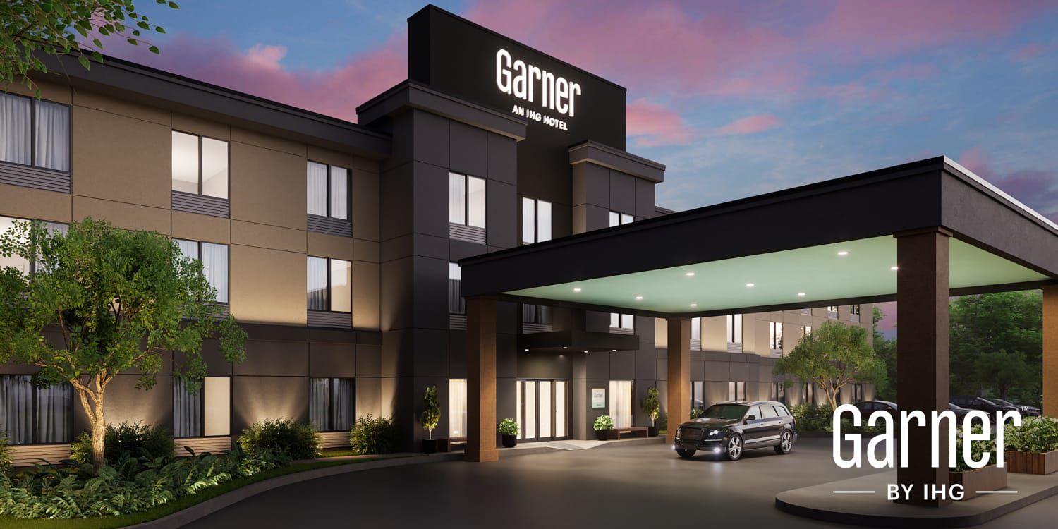 Exterior of a Garner hotel at dusk
