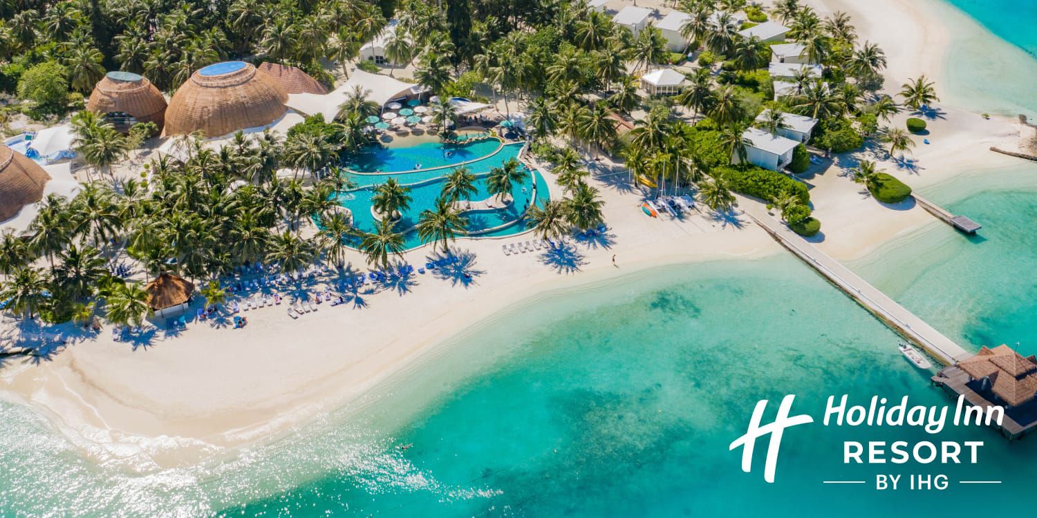 Aerial view of beachside resort &amp; pool