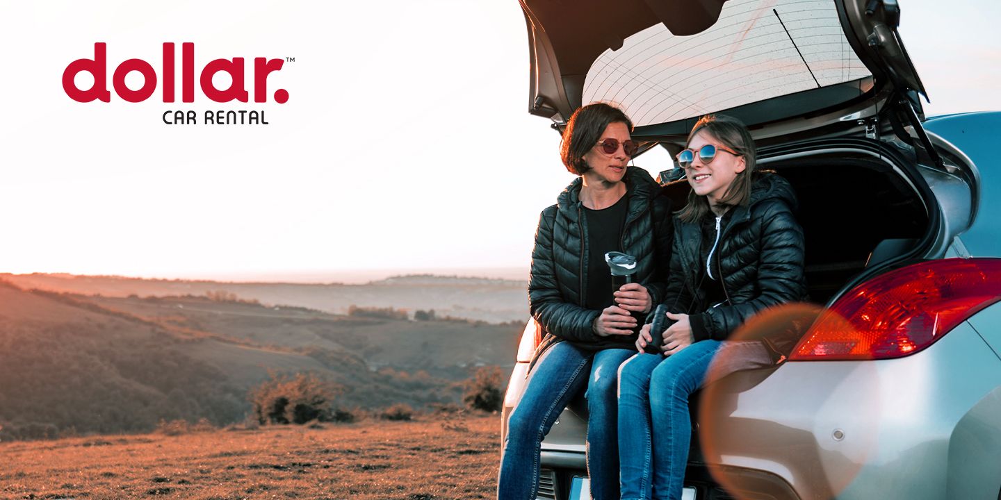 family sitting in rental car