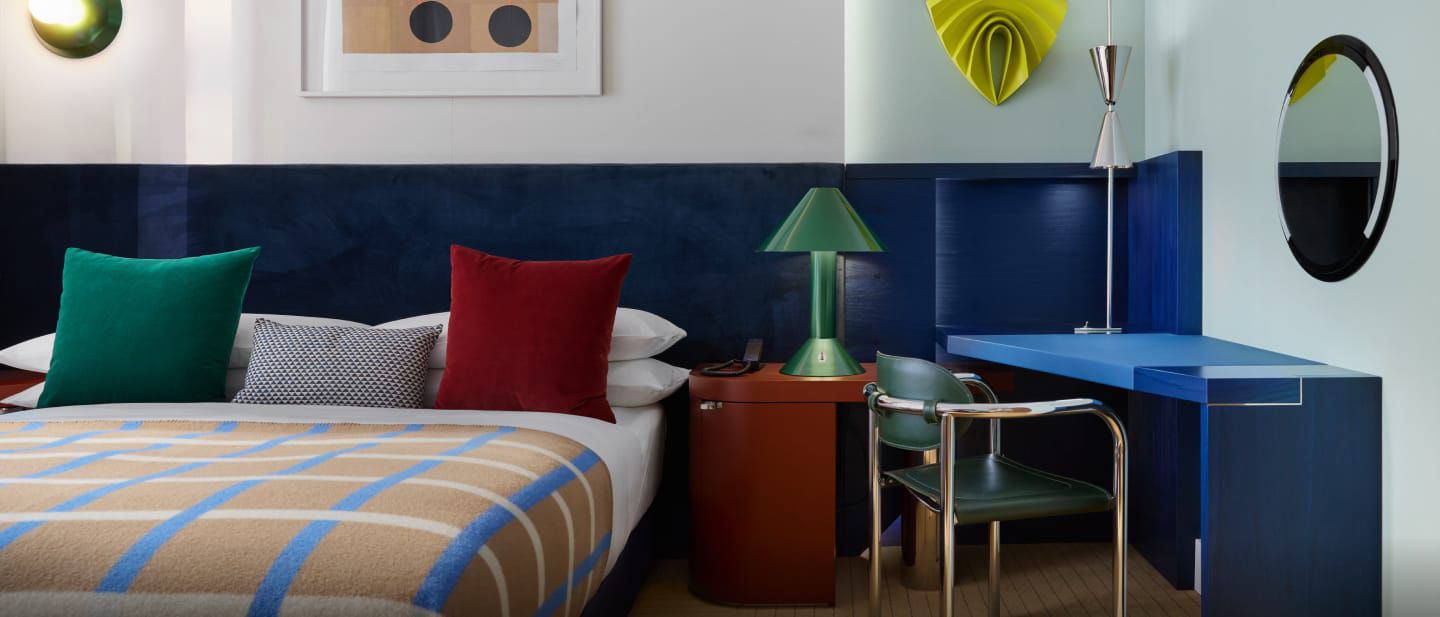 A bright and elegant guest room at the Kimpton® Main Frankfurt Hotel