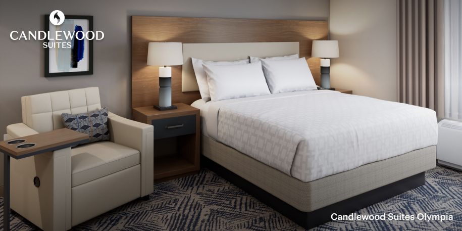  A convenient and well-appointed queen guest room at the DFW West Candlewood Suites.