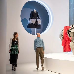 Modern fashion gallery with contemporary clothing displays indoors