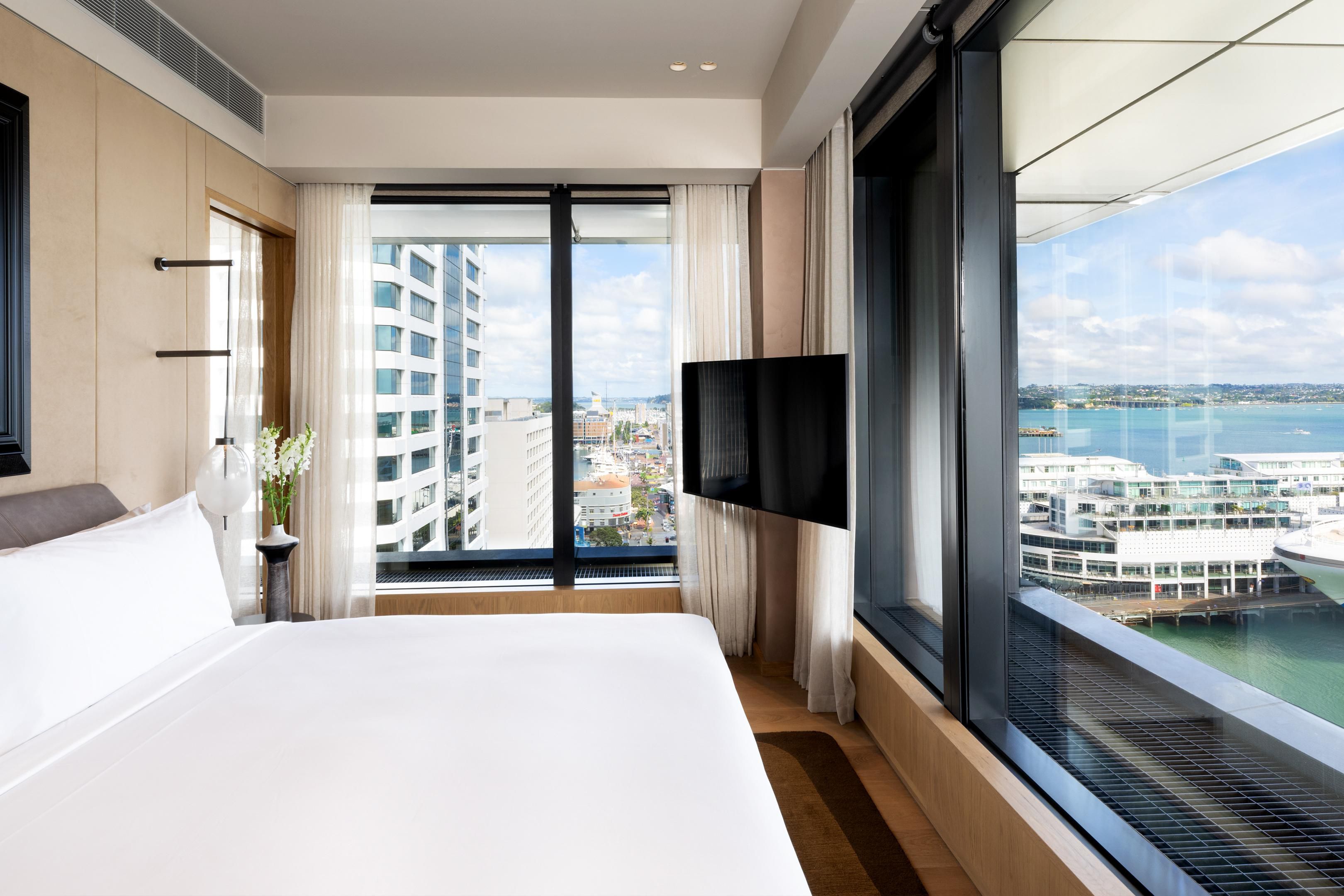 Suite with king bed overlooking harbour