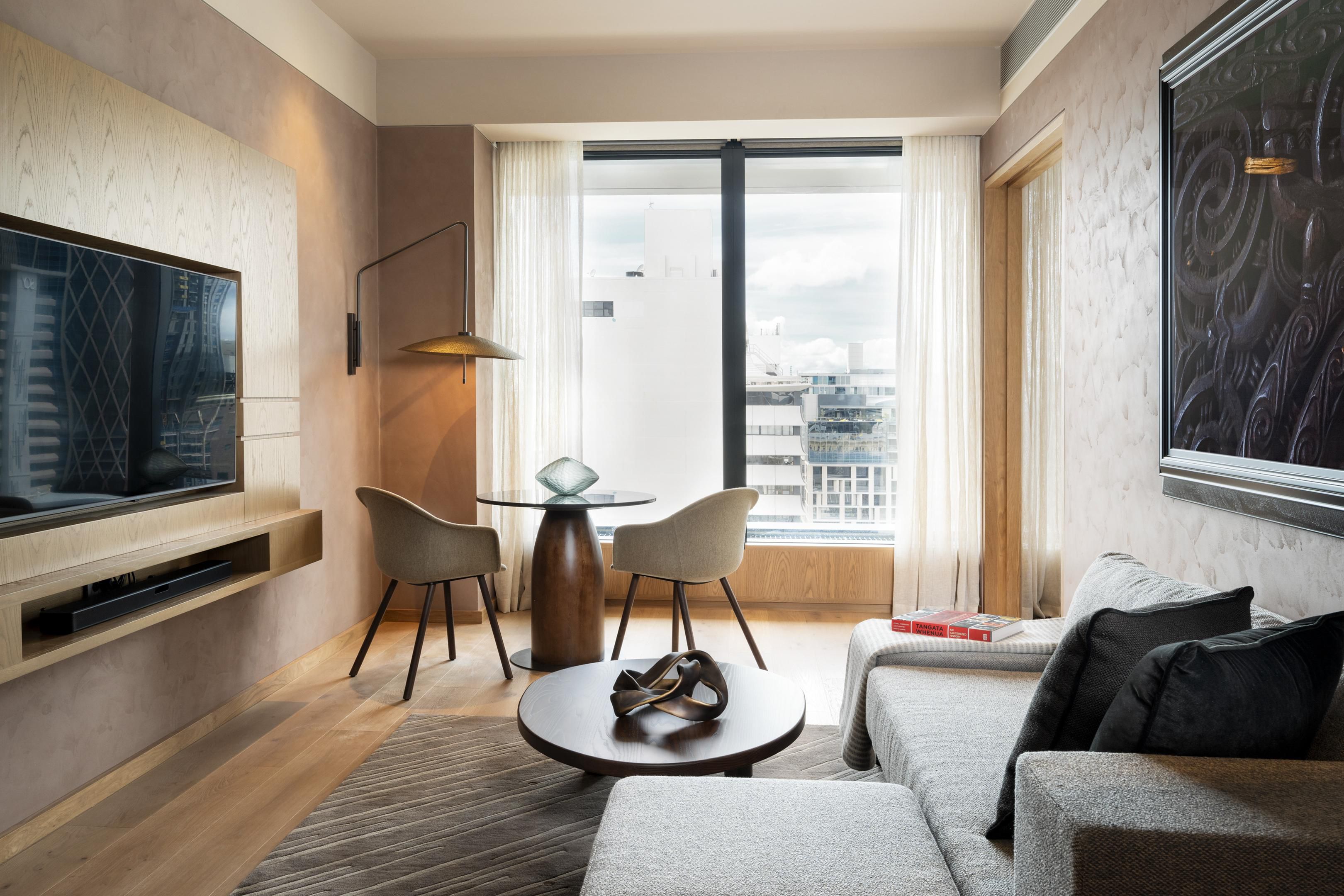 Suite includes additional living space with a tv, couch, and a small table