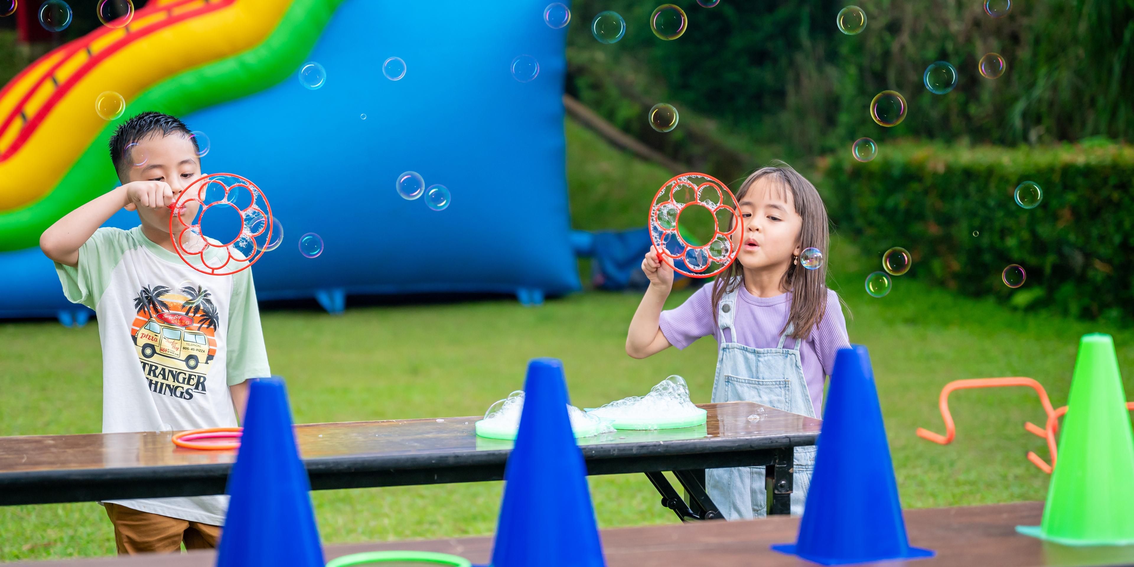 Enjoy exciting outdoor activities at Putting Green, including a bouncing castle, bubble blowing, badminton, kite flying, and more! With its lush green space and fresh air, it’s the perfect spot for fun-filled moments with your little ones to stay active and make lasting memories.

Available every Saturday - Sunday | 9 AM - 5 PM