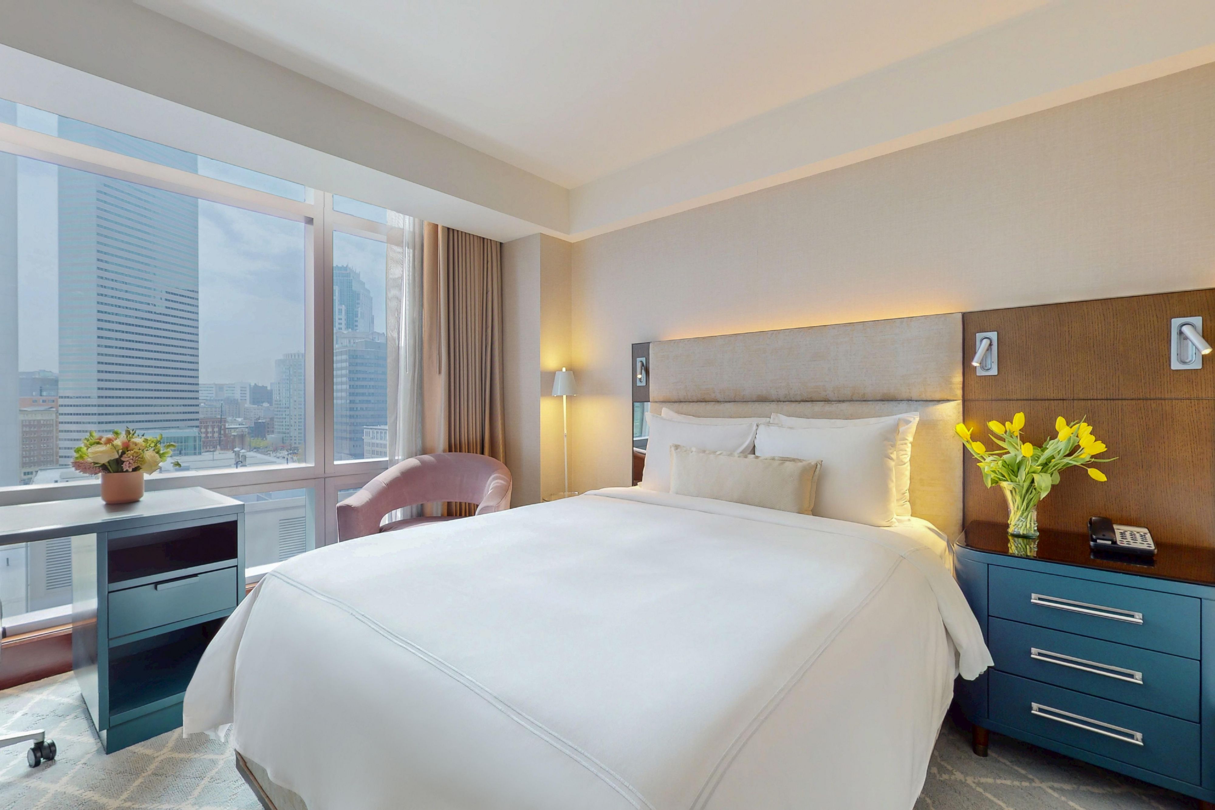 Club IC hotel room with bed and city views.