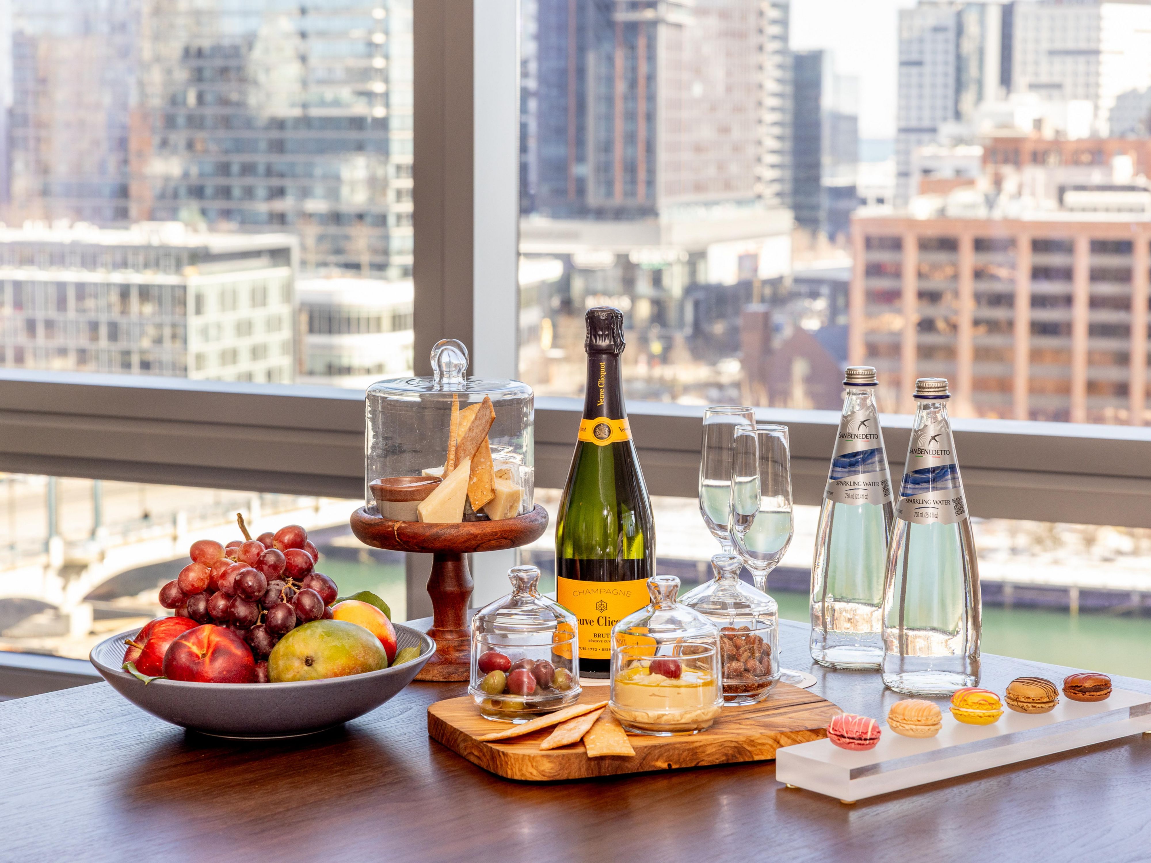 Table with fresh fruits, cheeses, and beverages in the InterContinental Lounge 