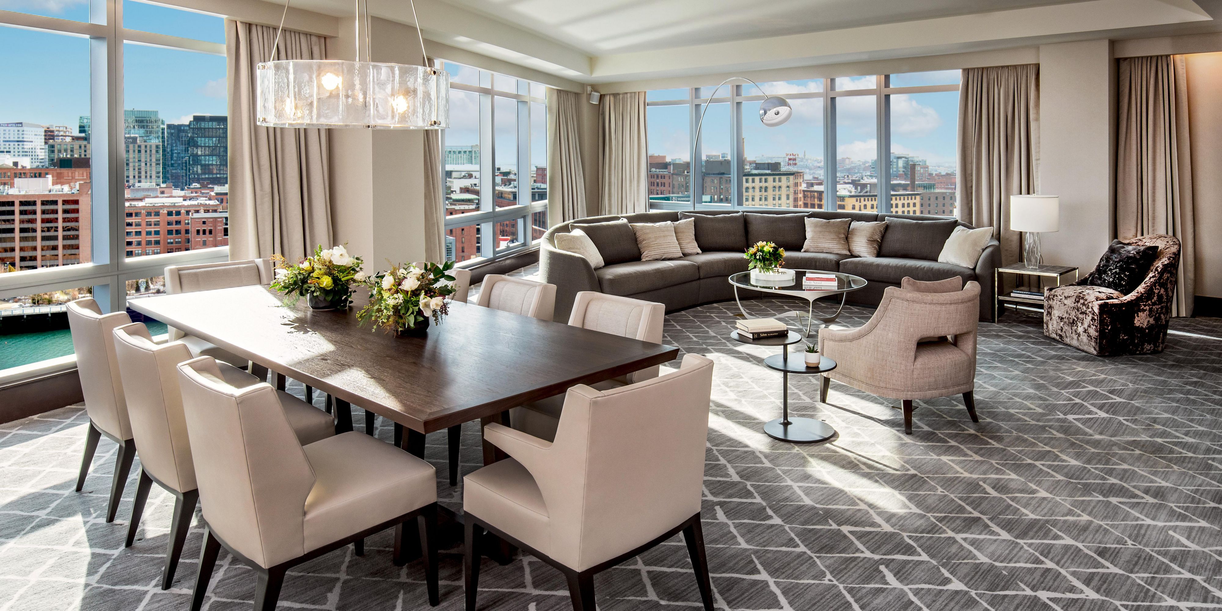 Waterfront living room framed by floor-to-ceiling windows